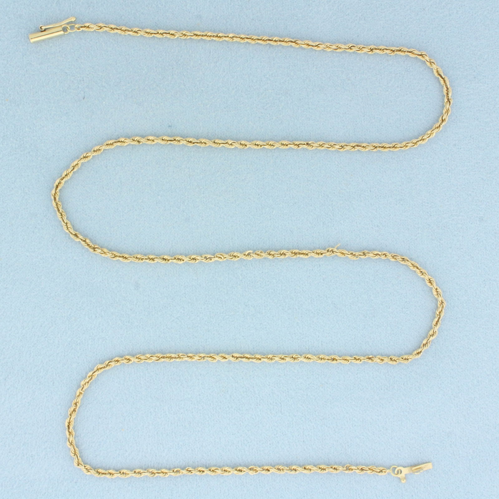 21 Inch Rope Link Chain Necklace in 14k Yellow Gold: In 14k Yellow Gold. 21 inches long. 2.1mm wide. Barrel clasp with safety latch. 6.7g.