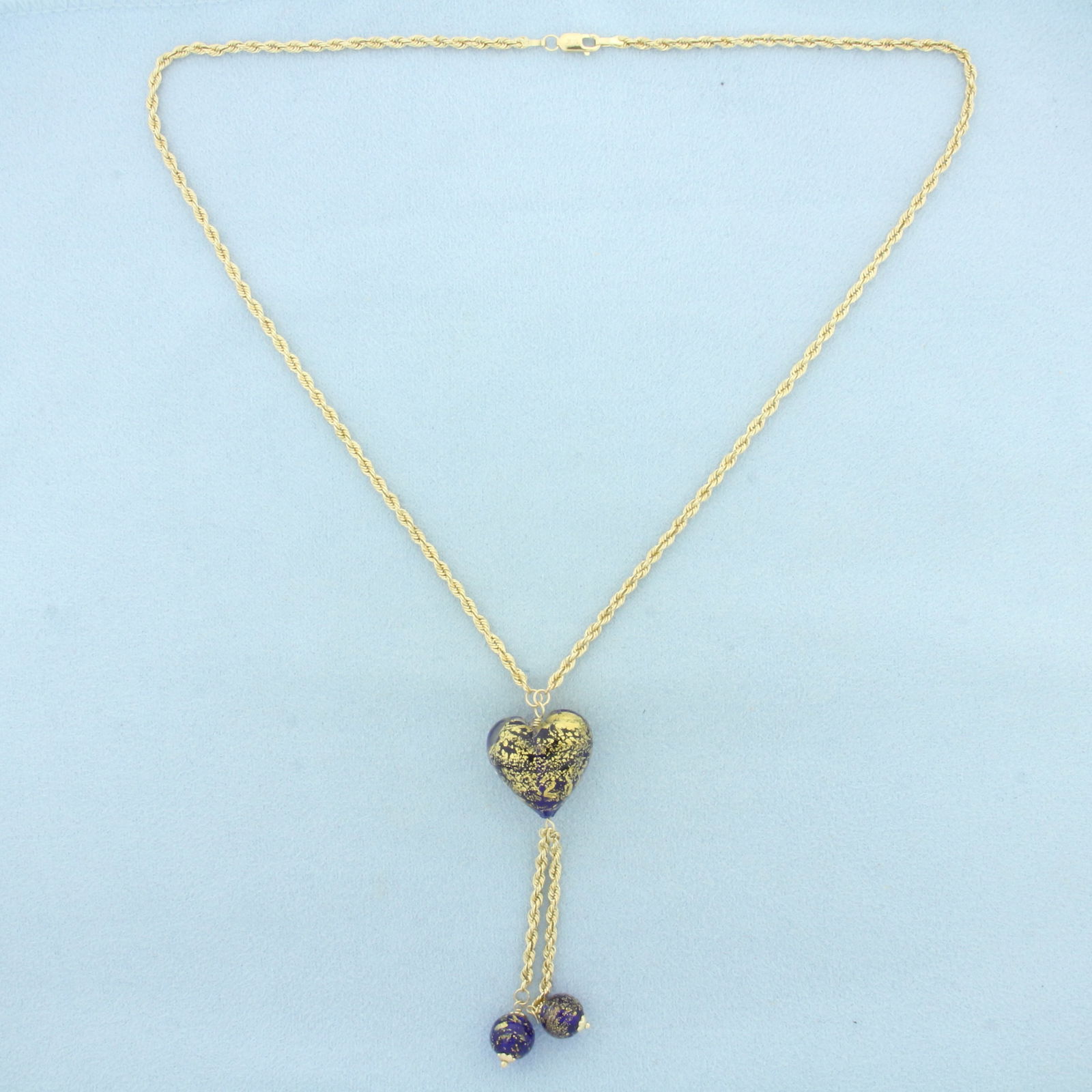 Murano Glass Heart Necklace in 14k Yellow Gold: In 14k Yellow Gold. 20 inches long. 2.1mm wide rope link chain. Heart is 19mm wide. Lobster clasp. 9.5g.
