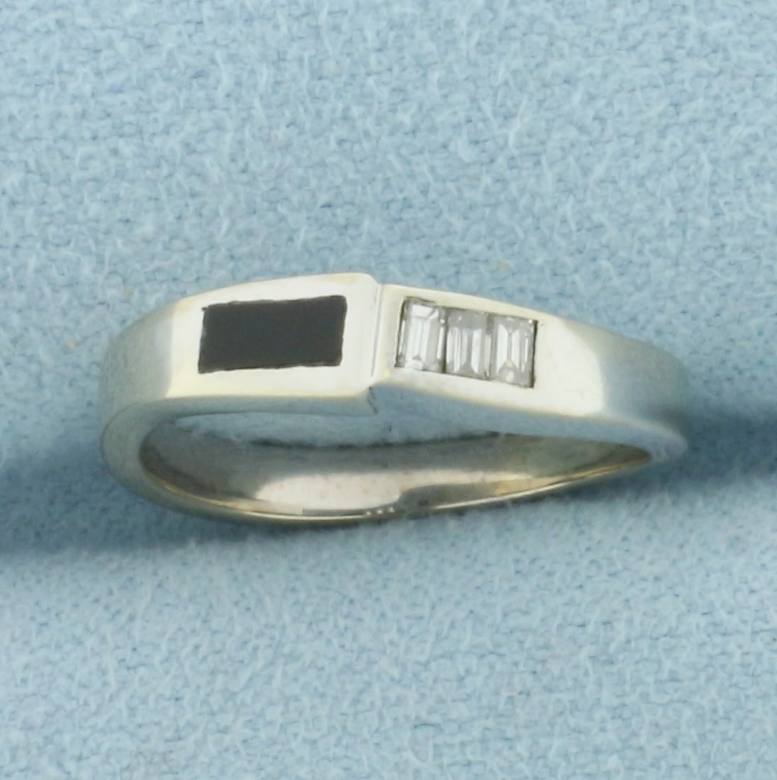 Onyx and Diamond Pinky Ring in 14k White Gold: In 14k White Gold. Contains three 2mm high quality baguette diamonds, VS clarity/G color. 5mm onyx plaque. 3.8mm wide at top of ring. Size 4. 2.4g.