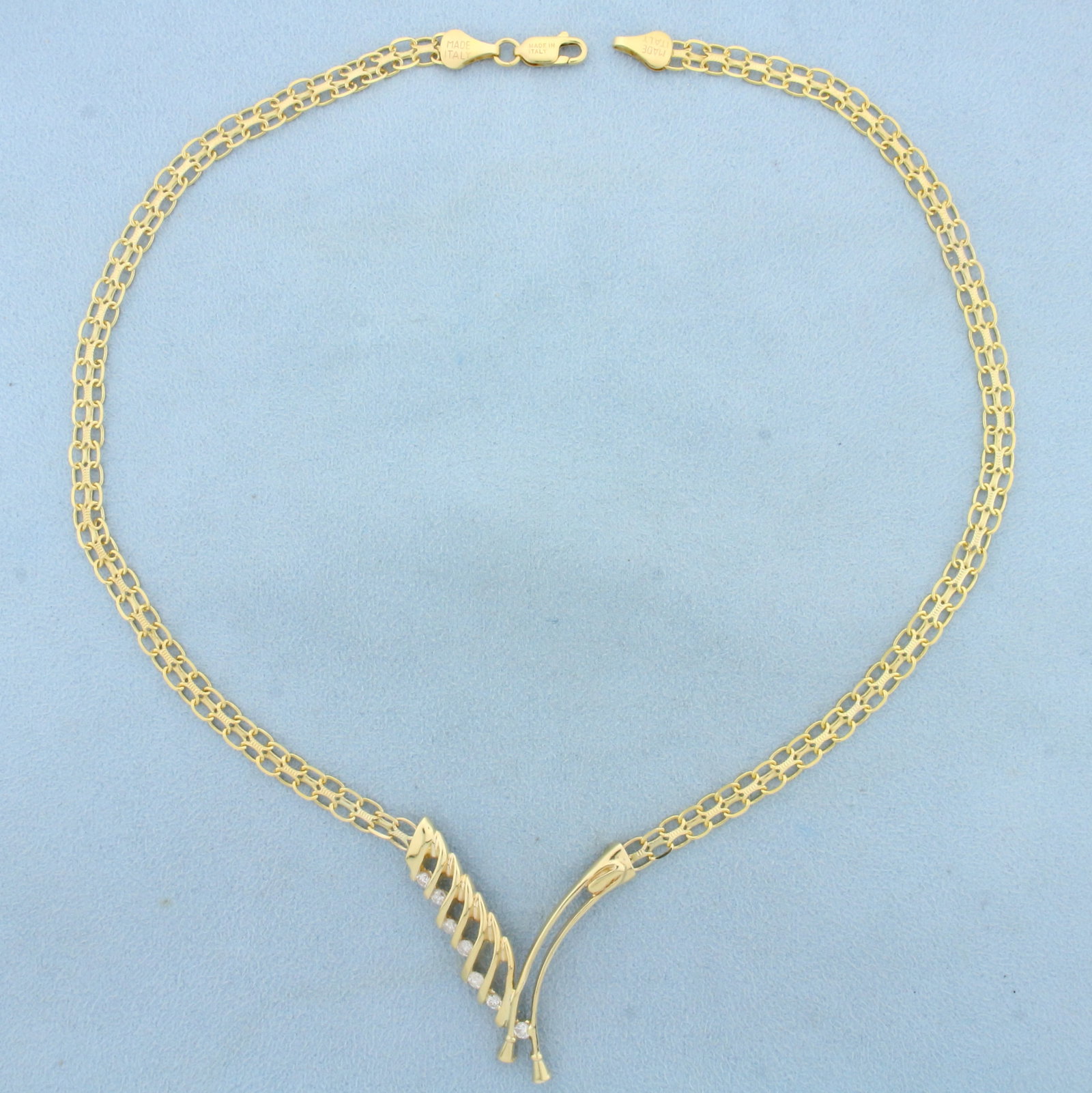 Italian Abstract Designer Bismarck Link Diamond Necklace in 14K Yellow Gold: In 14K Yellow Gold. Contains seven high quality Diamonds, 1/2ct TW, SI clarity/H color. 20 inches long, with lobster clasp. Pendant part is 1 3/4 inches long. 15.7g.