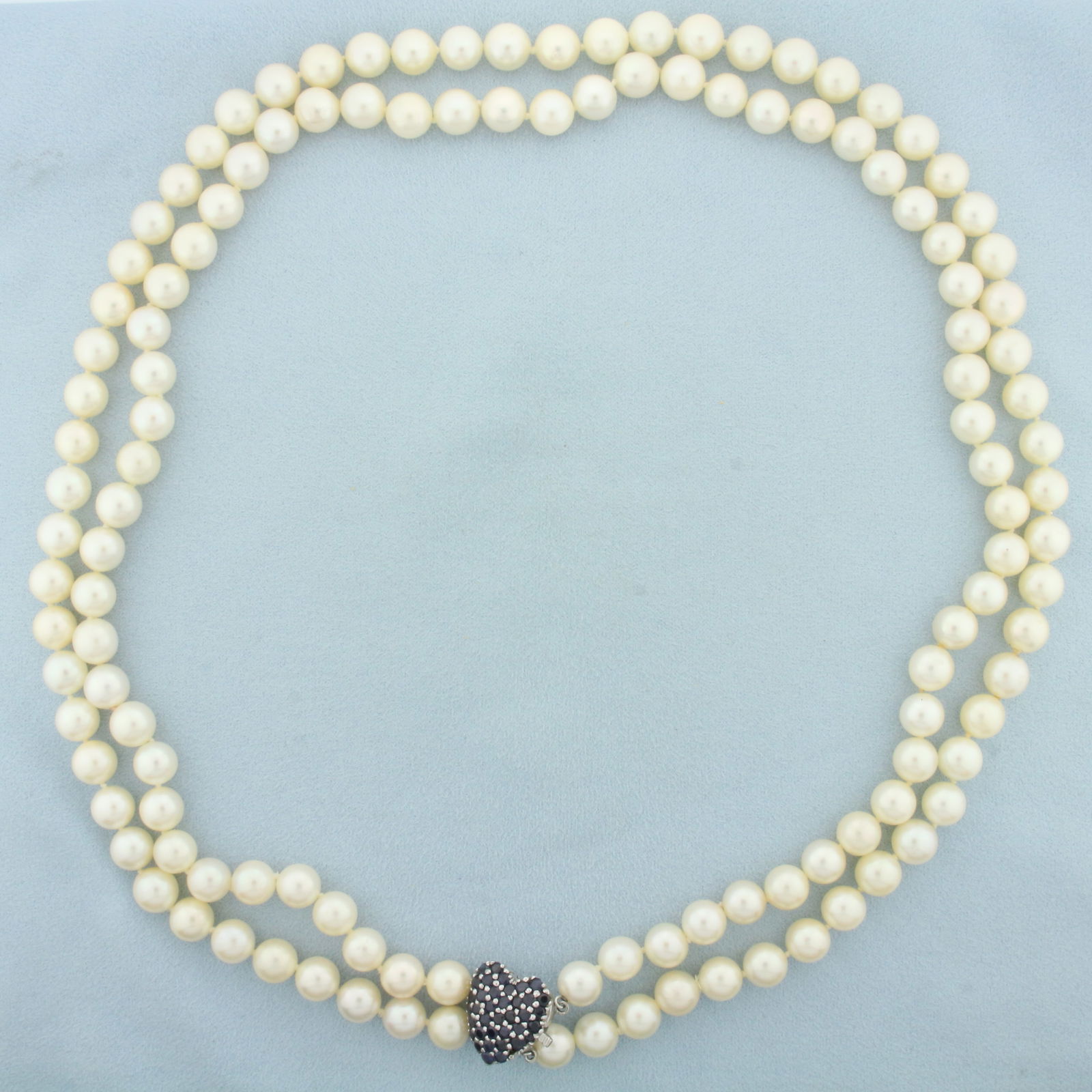 Vintage Sapphire Heart Akoya Pearl Necklace in 14k White Gold: 14k white gold clasp. Contains 37 high quality natural sapphires, 2ct TW, with deep blue color and excellent clarity. Short strand measures 22 inches including clasp with longer strand layering beneat