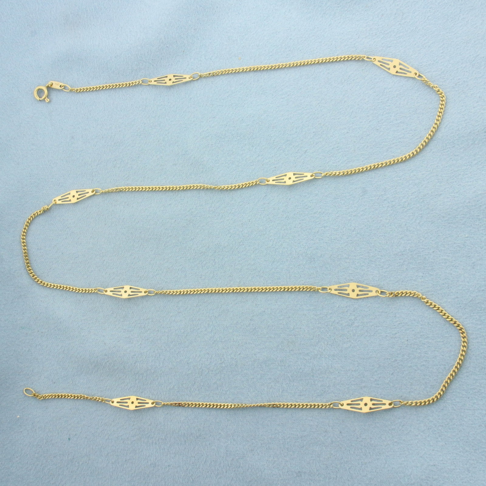 24 Inch Italian Curb Link Station Chain Necklace in 18k Yellow Gold: In 18k Yellow Gold. 24 inches long. 4.4mm wide at center of station pieces. Italian made. Spring clasp. 6.1g.