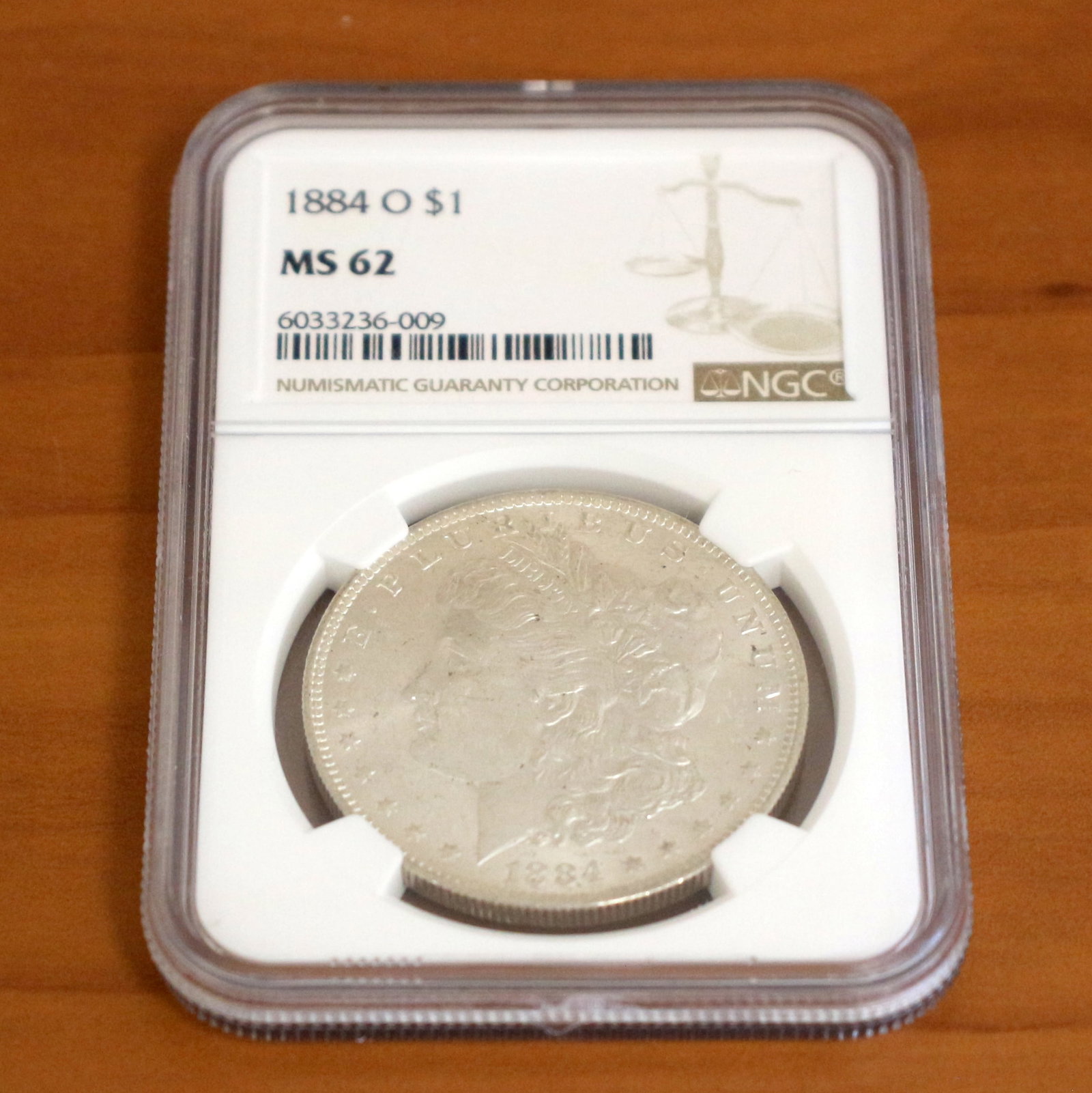NGC 1884-O MS62 Morgan Silver Dollar Coin: Contains one 1884 MS62 Morgan Silver Dollar. Packaged by NGC.