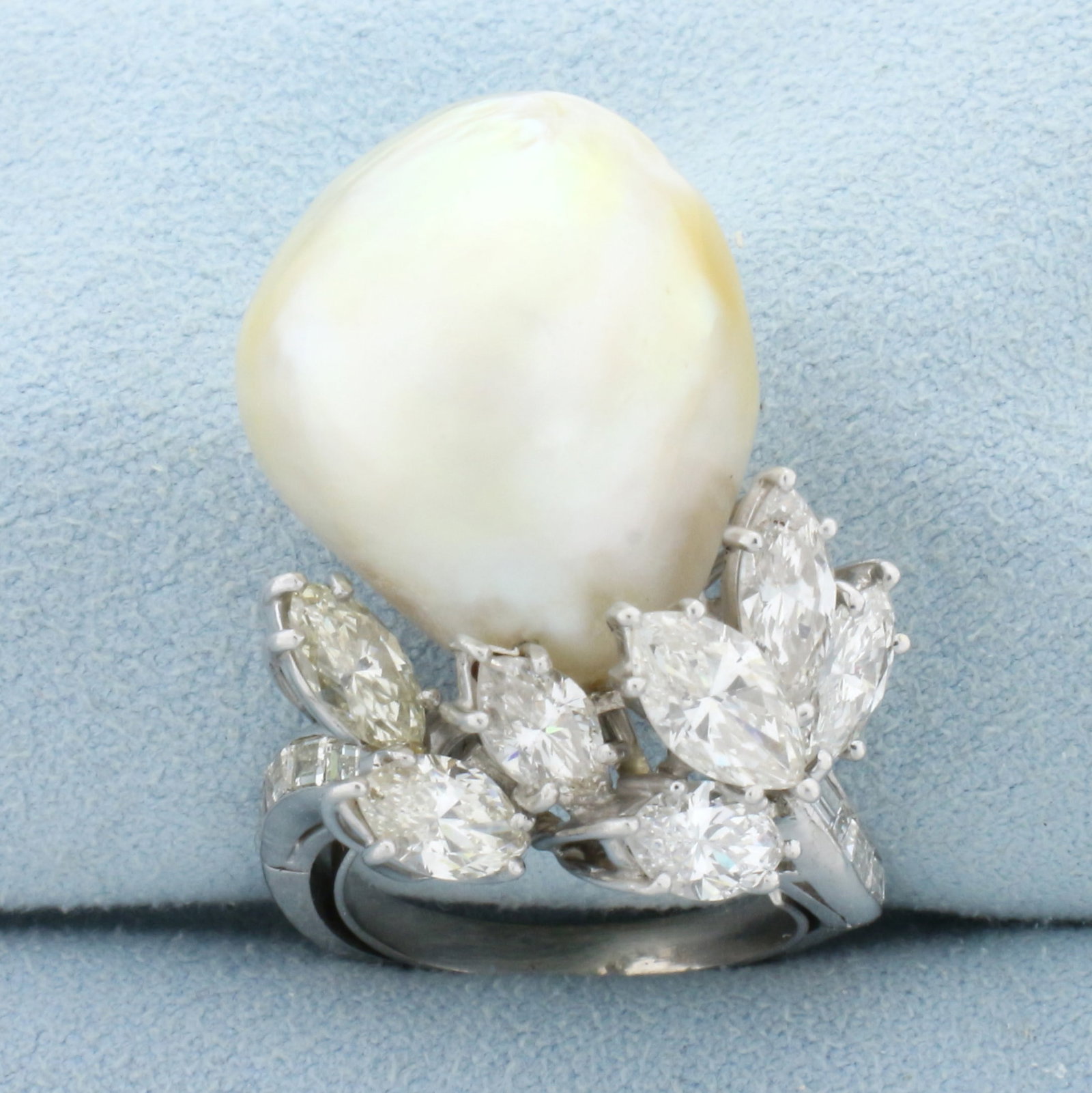 Designer One of A Kind Massive Pearl and Diamond Statement Ring in Platinum: In Platinum. Contains one high quality natural extremely large 20x17mm Baroque Pearl with excellent luster and iridescent undertone. Also contains seven high quality 8.5 x 4.5mm marquise cut and eight