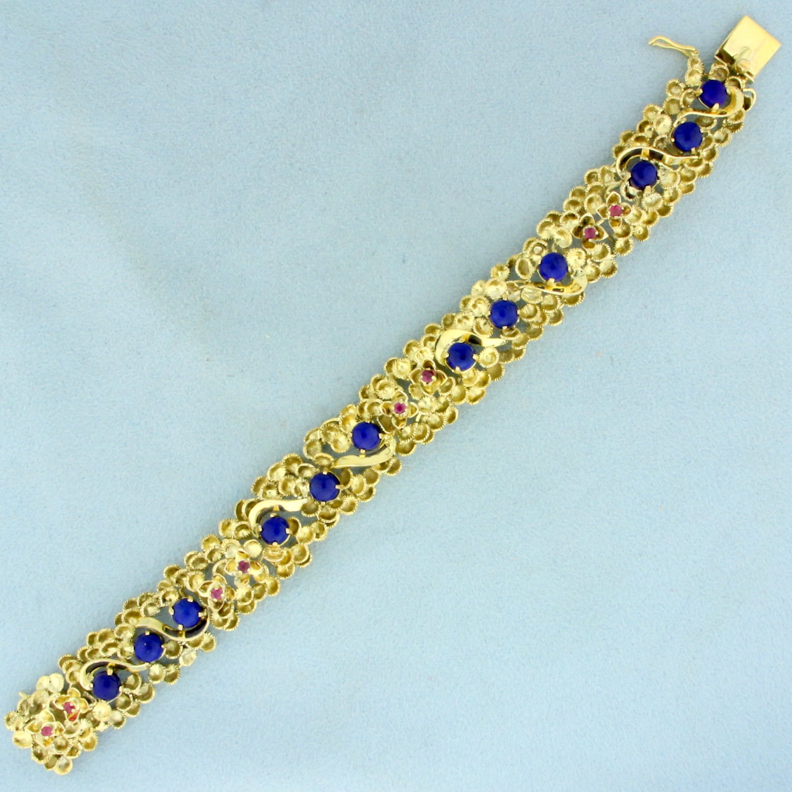 Designer Vintage Ruby and Lapis Lazuli Bracelet in 14K Yellow Gold: In 14K Yellow Gold. Contains eight high quality natural 2.25mm Ruby gemstones with vibrant red color and excellent clarity. Also contains twelve 5.25mm Lapis Lazuli gemstone with intense blue color. 7