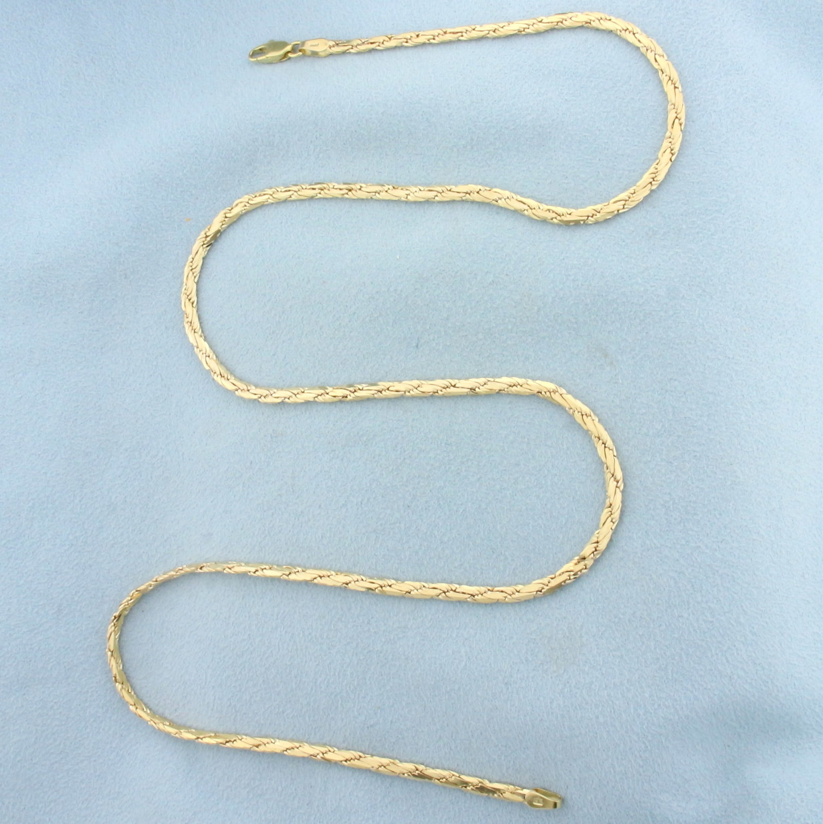 20 Inch Italian Flat Rope Link Chain Necklace in Solid 14k Yellow Gold: In 14k yellow gold. 20 inches long and 2.8mm wide. Lobster clasp. 16.0g.