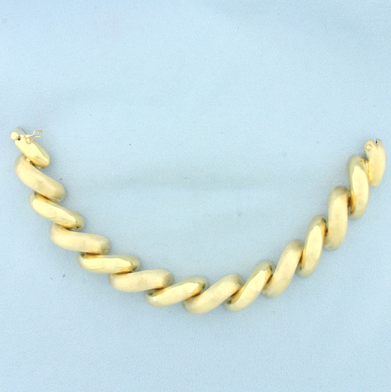 Large Italian San Marco Macaroni Link Bracelet in 14k Yellow Gold: In 14k yellow gold. Italian made. 7 3/4 inches long and 5/8 inch wide. Links alternate between high polish and brushed finish for unique look. Concealed clasp with safety latch. 33.0g.