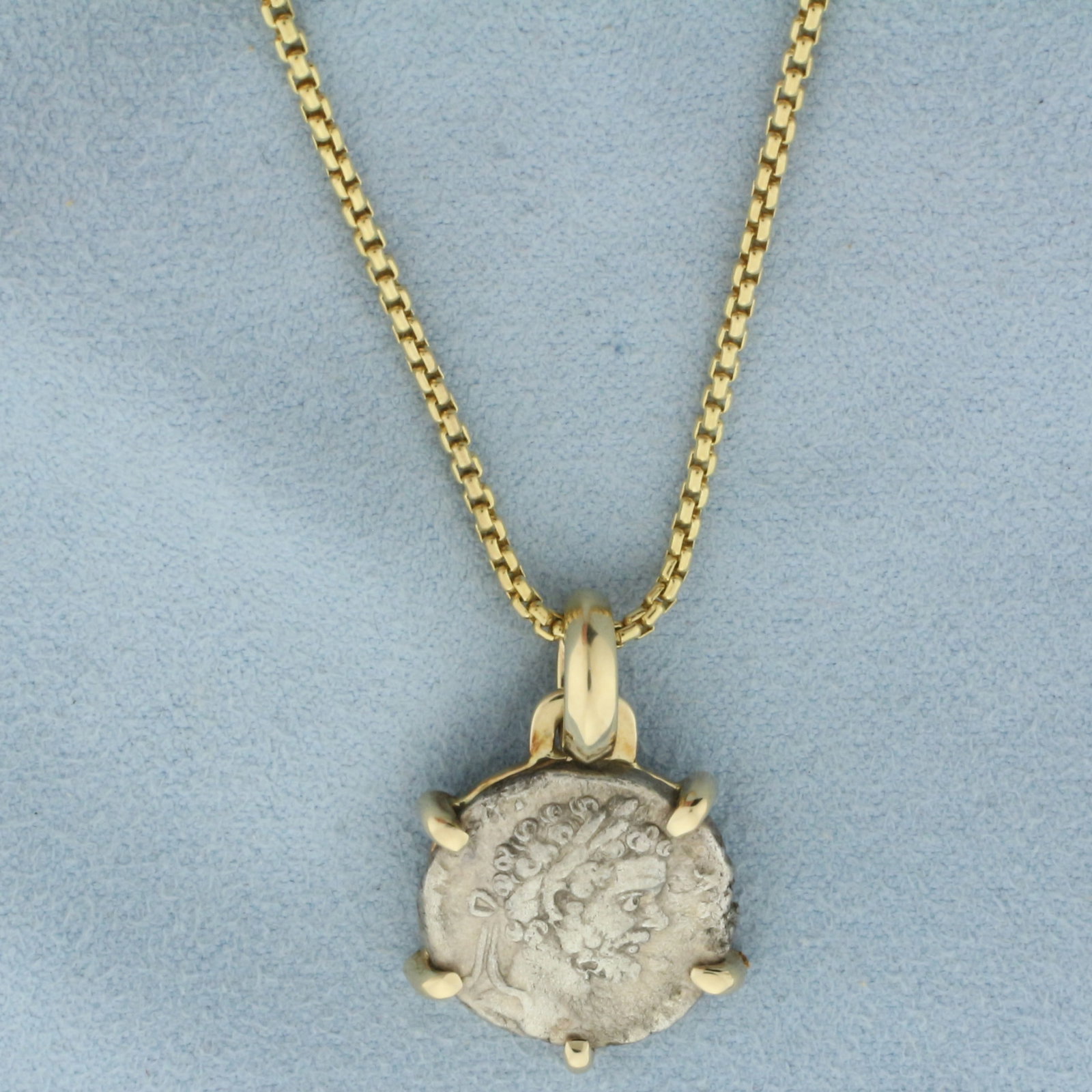 Roman Empire Silver Denarius Coin Necklace in 14k Yellow Gold: In 14k yellow gold. Chain is 20 1/2 inches long and 1.6mm wide, lobster clasp. Pendant is 1 inch long (including bale, and 3/4 inch wide. Coin is Silver Denarius Coin from Roman Empire period. 13.2g.