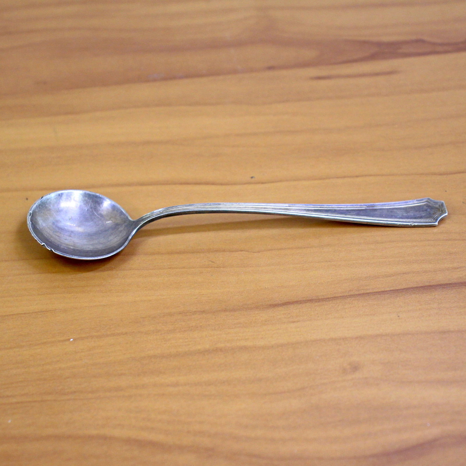 Durgin "Fairfax" Sterling Silver Chocolate Spoon: In .925 Sterling Silver. Contains one large chocolate spoon. 5 1/2 inches long. Some pitting on back of bowl, as shown in picture. 24.1g.