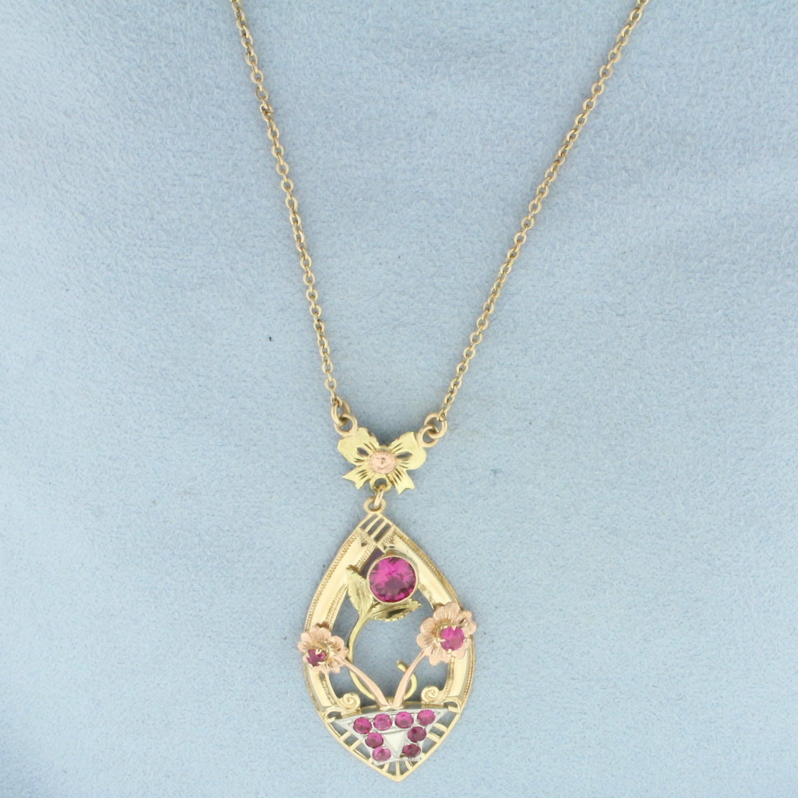 Vintage Pink Sapphire Flower Lavalier Necklace in 10k Yellow, Rose, White, and Green Gold: In 10k Yellow, Rose, White, and Green Gold. Contains high quality natural 6mm, 3.2mm, and nine 2.3mm Pink Sapphire gemstones with intense color and excellent clarity. Cable link chain is 15 3/8 inches