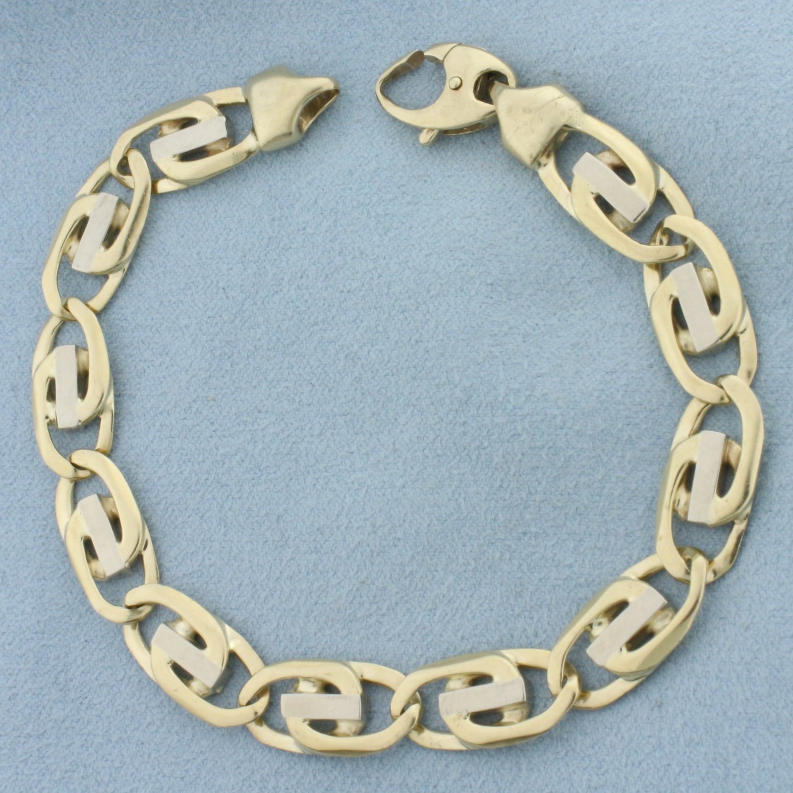 Mens Italian Fancy Designer Link Two Tone Bracelet in 10k Yellow and White Gold: In 10k Yellow and White Gold. 8 5/8 inches long. 3/8 inch wide. Lobster clasp. 24.9g.