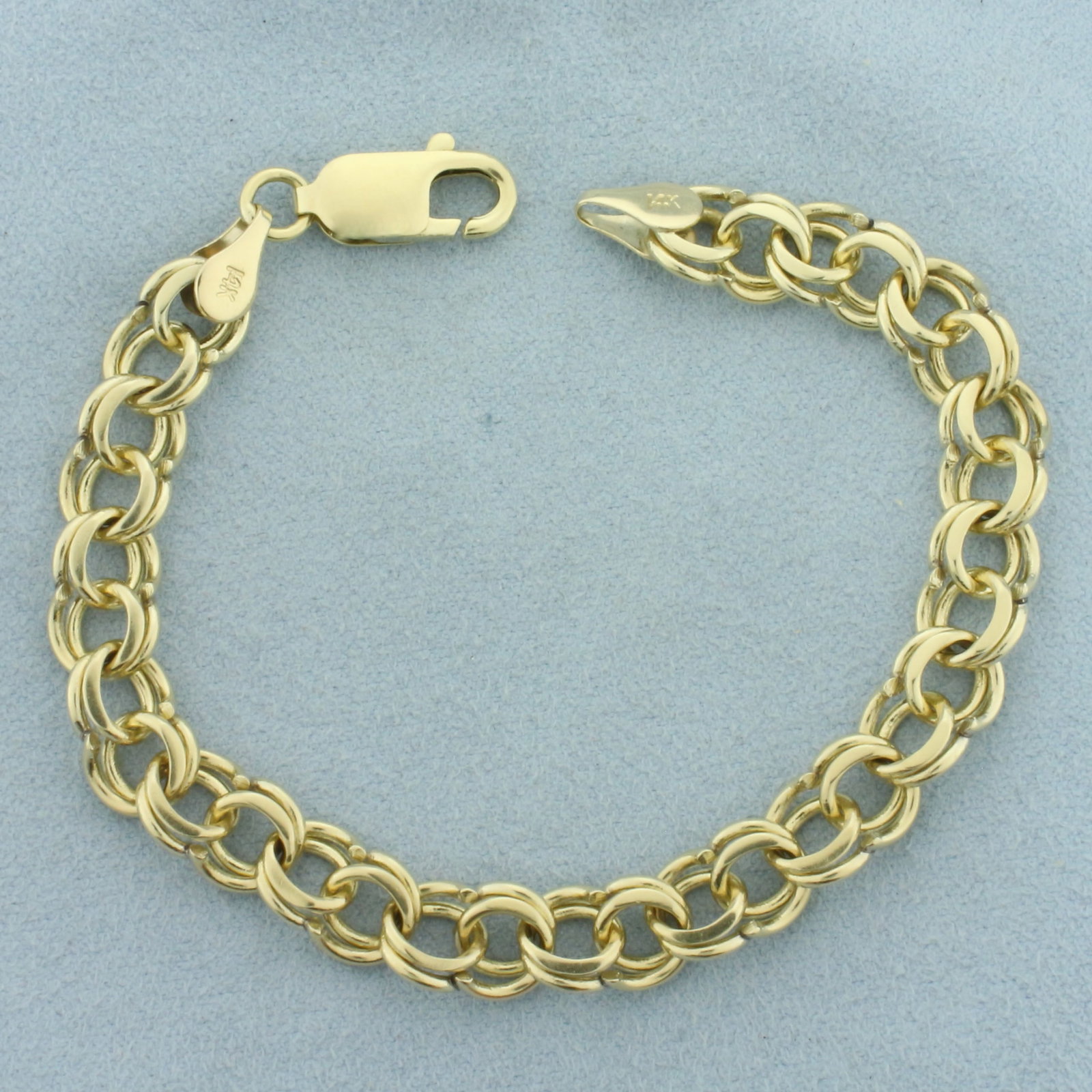 Double Loop Cable Link Charm Bracelet in 14k Yellow Gold: In 14k Yellow Gold. 7 1/4 inches long. 8mm wide. Lobster clasp. 16.8g.
