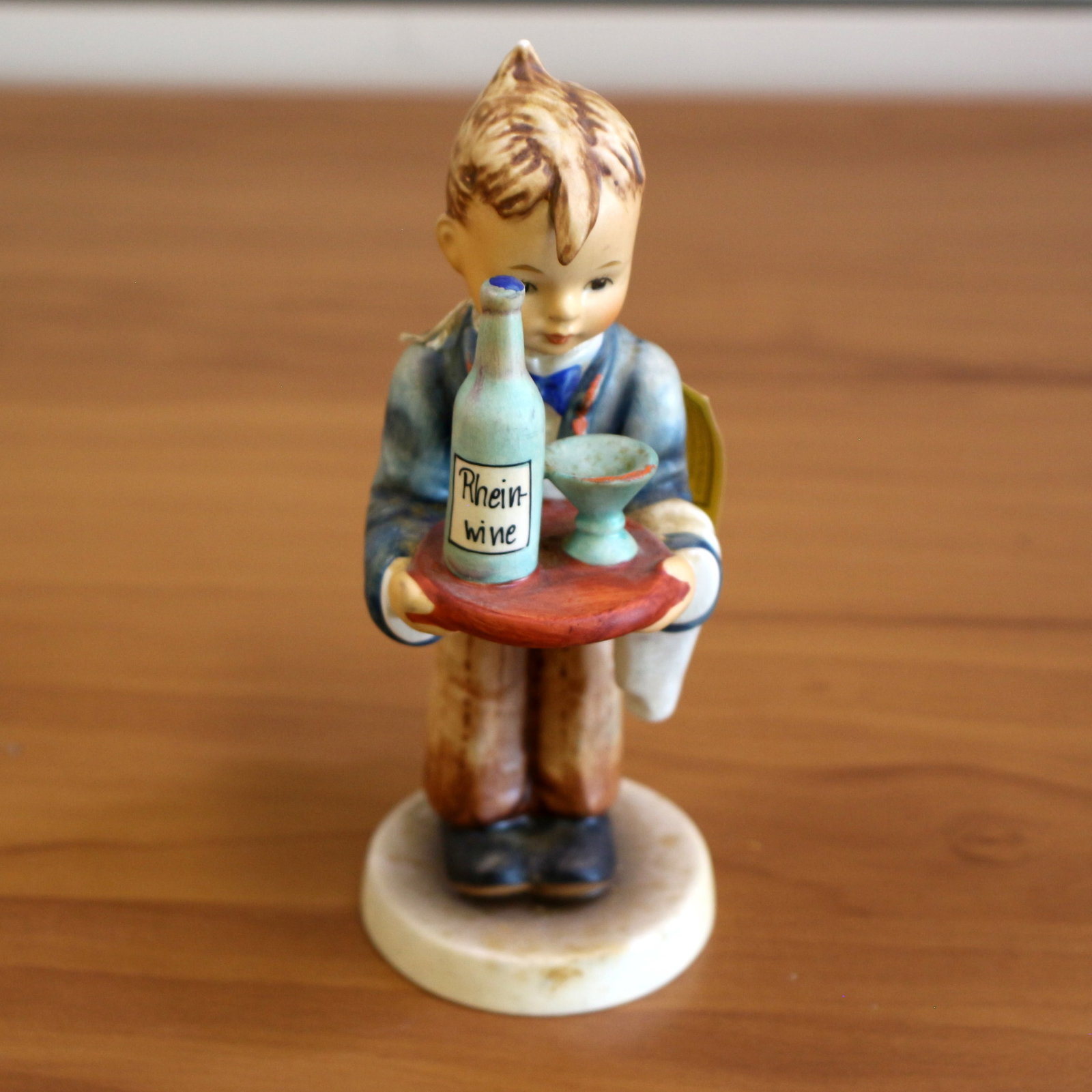 Goebel "Waiter" Hummel Figurine: 6 3/4 inches tall. 4 1/2 inches wide. Original Goebel Collectors' Club tag. Signed. #154/0.