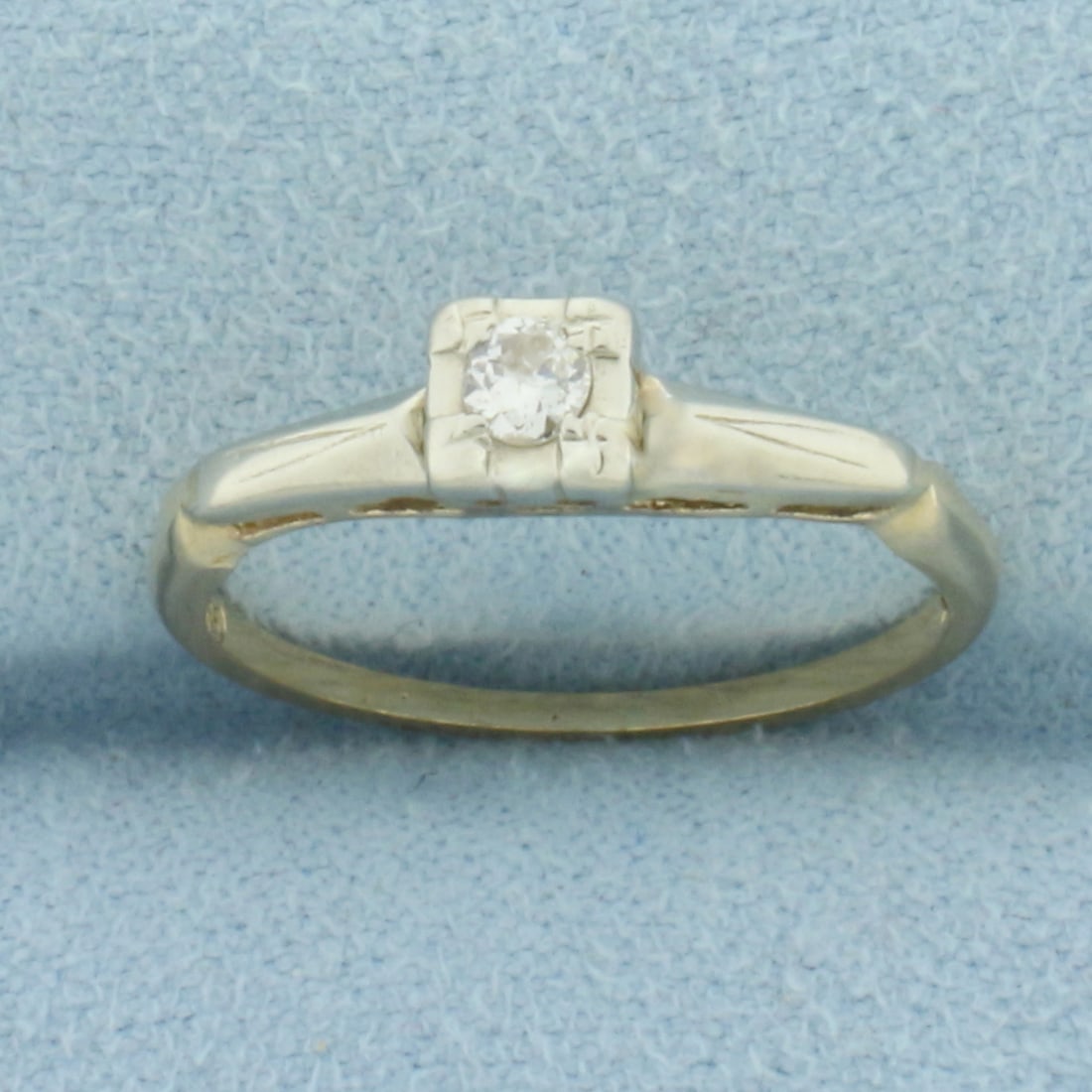 Vintage Diamond Solitaire Ring in 14k Yellow Gold: In 14k Yellow Gold. Contains one .08ct high quality round brilliant diamond, SI clarity/H color. Size 6. 1.6g.