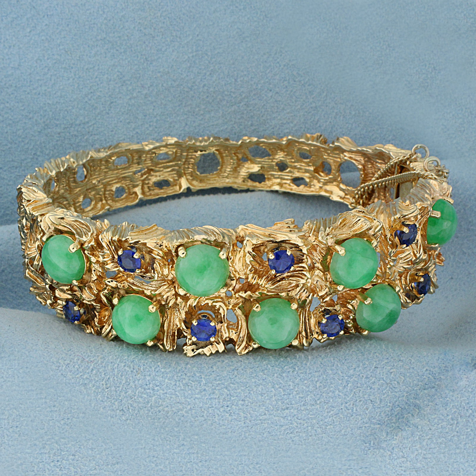 Graduated Natural Sapphire and Jade Heavy Bangle Bracelet in 14K Yellow Gold: In 14K Yellow Gold. Contains seven high quality natural 7.5mm Jade gemstones with beautiful green color. Also contains seven high quality natural "AAA" quality 3.7mm Sapphire gemstones with intense bl