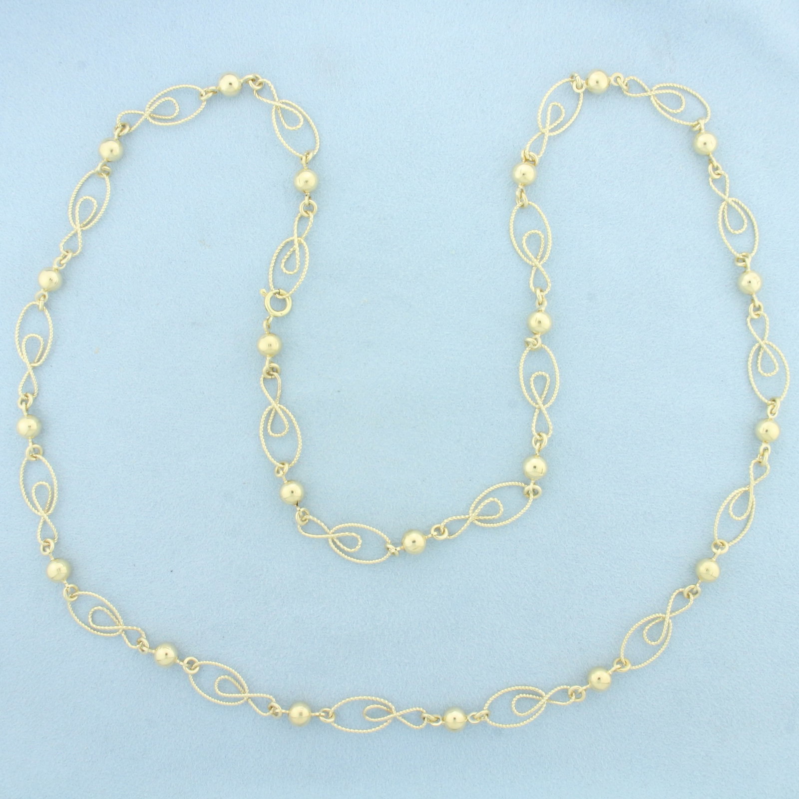 Extra Long Designer Link Ball Bead Necklace in 14k Yellow Gold: In 14k Yellow Gold. 31 inches long. 3/8 inch wide at widest. Spring clasp. 27.5g.