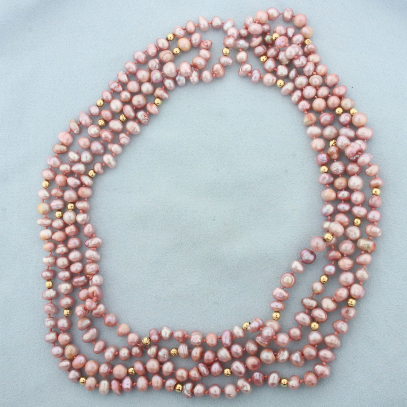 Baroque Pink Pearl and Gold Ball Bead Double Strand Necklace: Contains 7-8mm high quality pink baroque pearls with high luster. 4mm gold ball beads. Longer strand 40 inches long. Hand knotted. 88.3g.