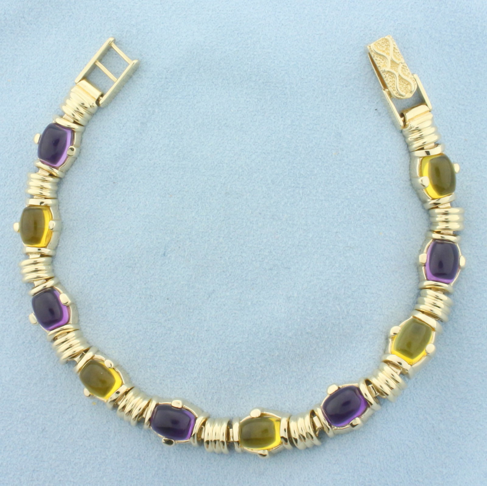 Heavy Amethyst and Citrine Bracelet in 14k Yellow Gold: In 14k Yellow Gold. Contains five 6x9mm high quality natural Citrine gemstones, approximately 10ct TW, with vibrant color and excellent clarity. Also contains five 6x9mm high quality natural Amethyst