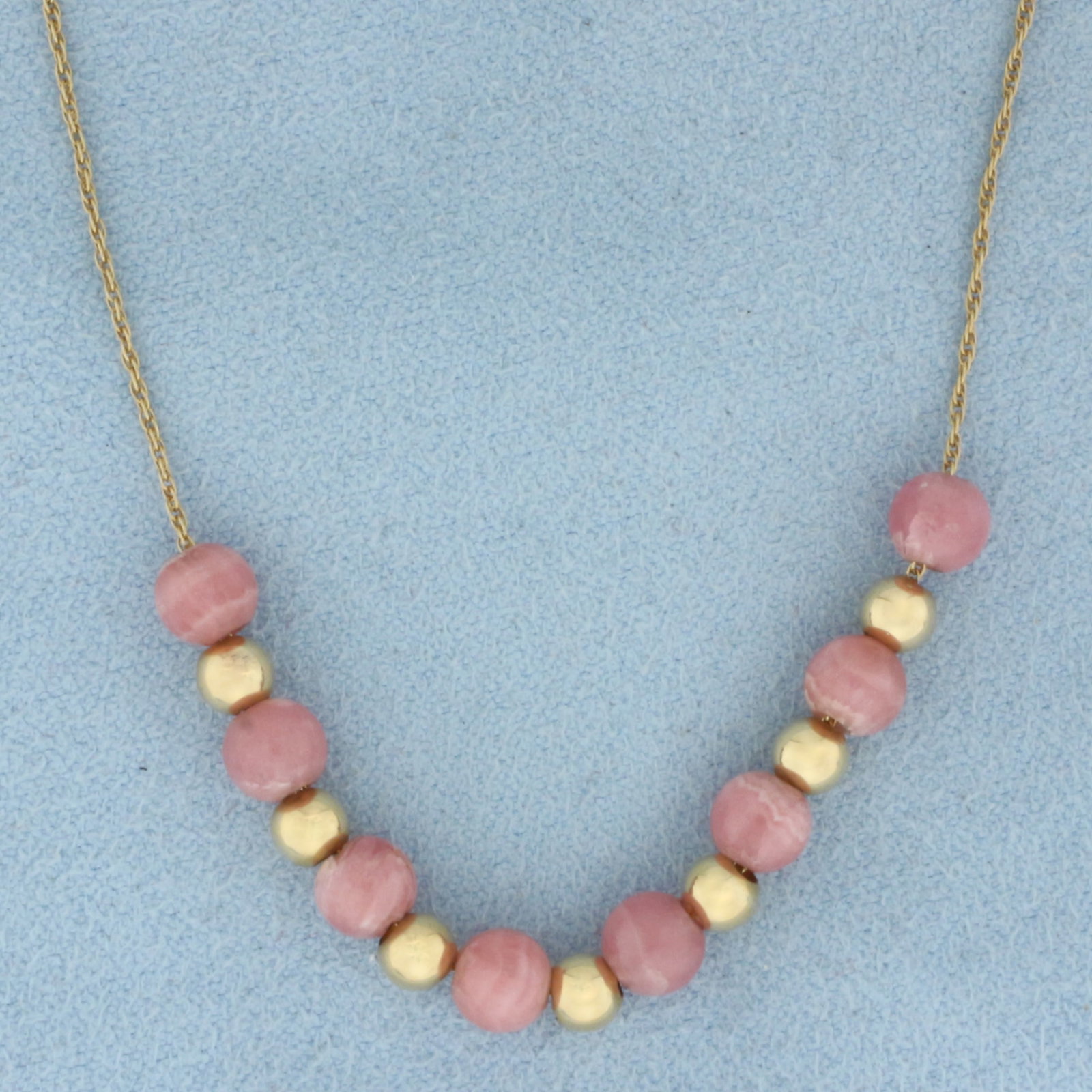 Morganite and Ball Bead Necklace in 14K Yellow Gold: In 14K Yellow Gold. Contains eight 5.2mm high quality natural Morganite gemstone gemstones with beautiful pink salmon color. Also contains seven 3.9mm gold balls. 16 1/2 inch long rope style chain. 2.