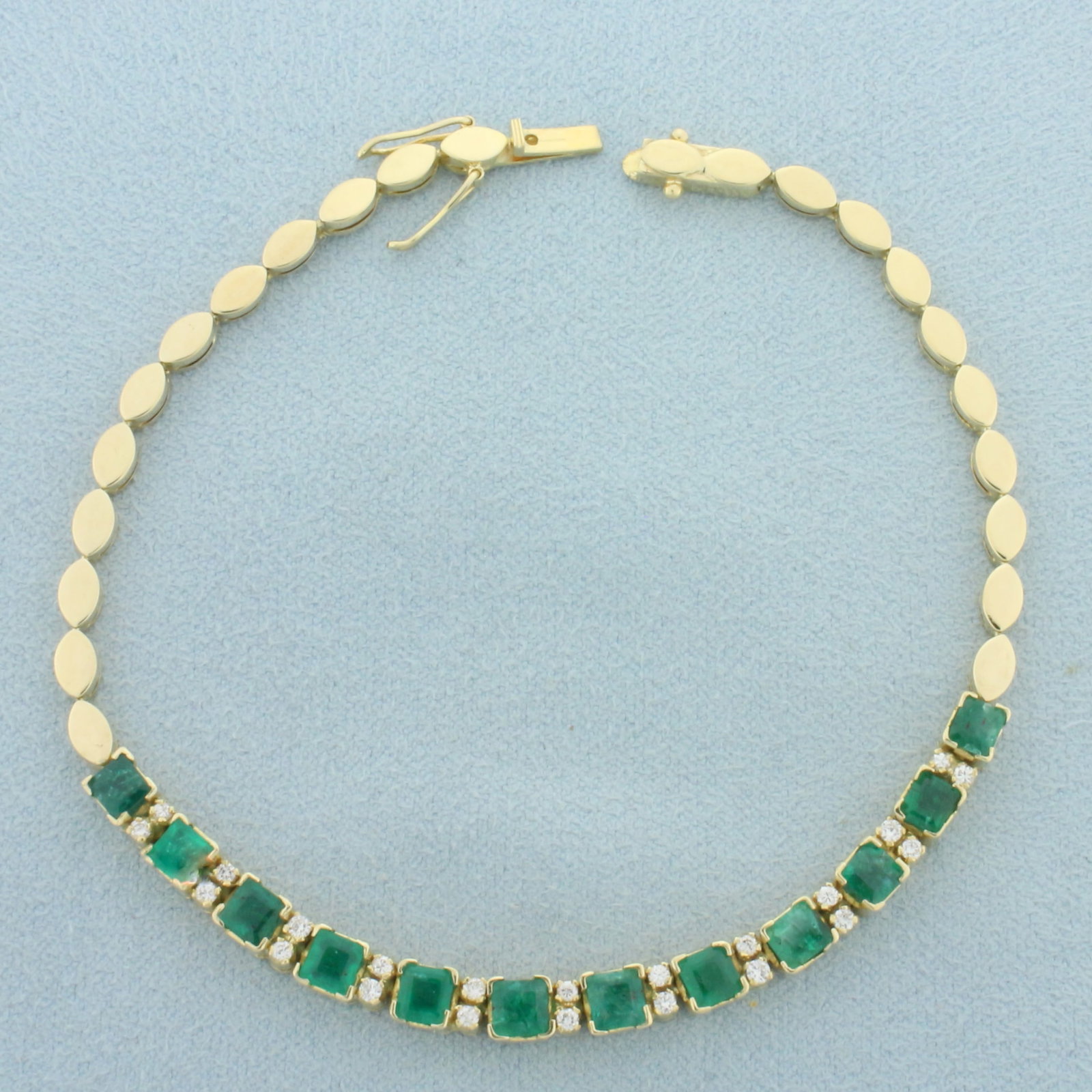 Natural Emerald and Diamond Bracelet in 18k Yellow Gold: In 18k yellow gold. Contains twelve high quality natural untreated 3.8mm square cut emeralds with intense green color. Also contains twenty two high quality .01ct round brilliant diamonds, VS clarity/