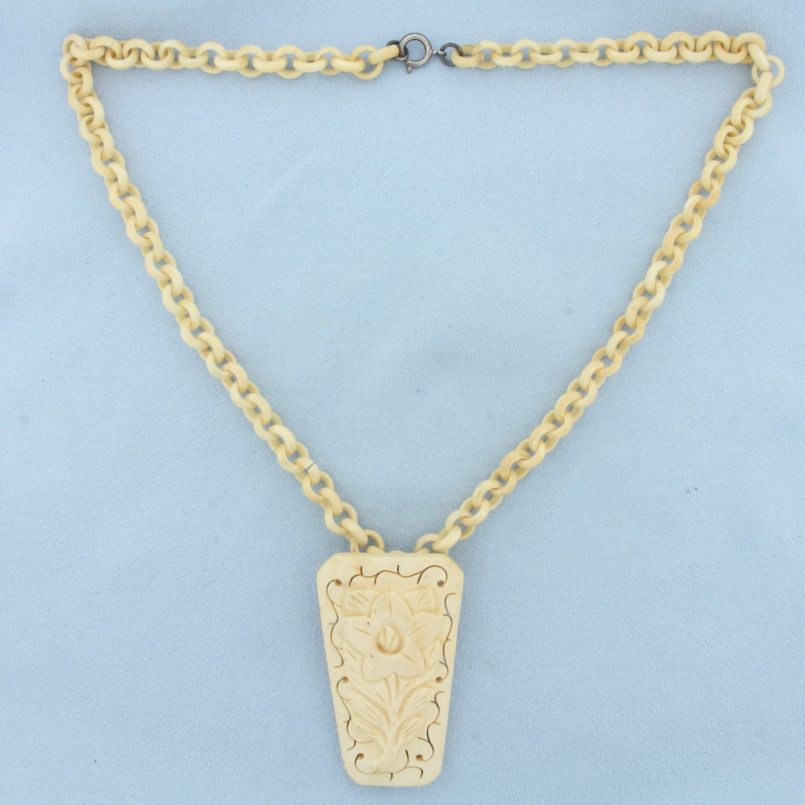 Vintage Hand Carved Bone Necklace With Sterling Silver Clasp: .925 sterling silver, clasp. Chain is 18 inches long. Pendant is 2 1/8 inches by 1 1/4 inches. 24.6g.