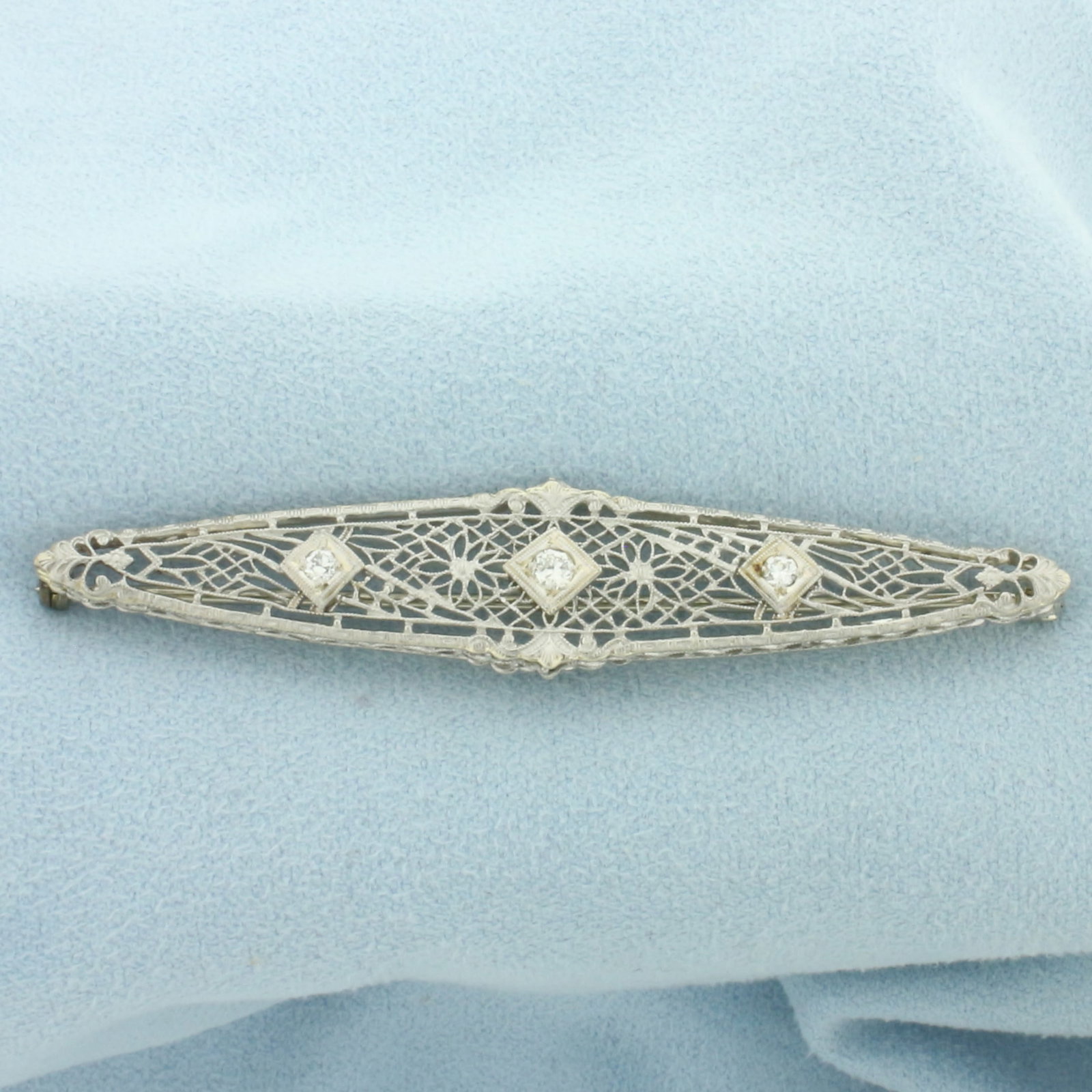 Vintage Filigree Diamond Pin in 14k White Gold: In 14k White Gold. Contains one .08ct and two .04ct high quality diamonds, VS clarity/H color.. 2 1/2 inch long. 1/2 inch wide. 4.5g.
