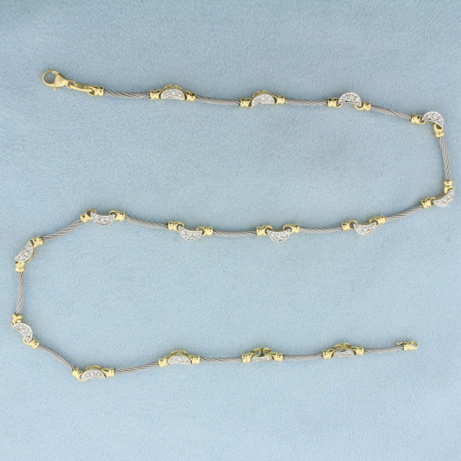 Charriol Phillip Designer Diamond Cable Link Necklace in 18k Yellow Gold and Steel: In 18k Yellow Gold and Steel. Contains forty-five high quality 1/2pt diamonds. 16 inches long. Lobster clasp. 15.6g.