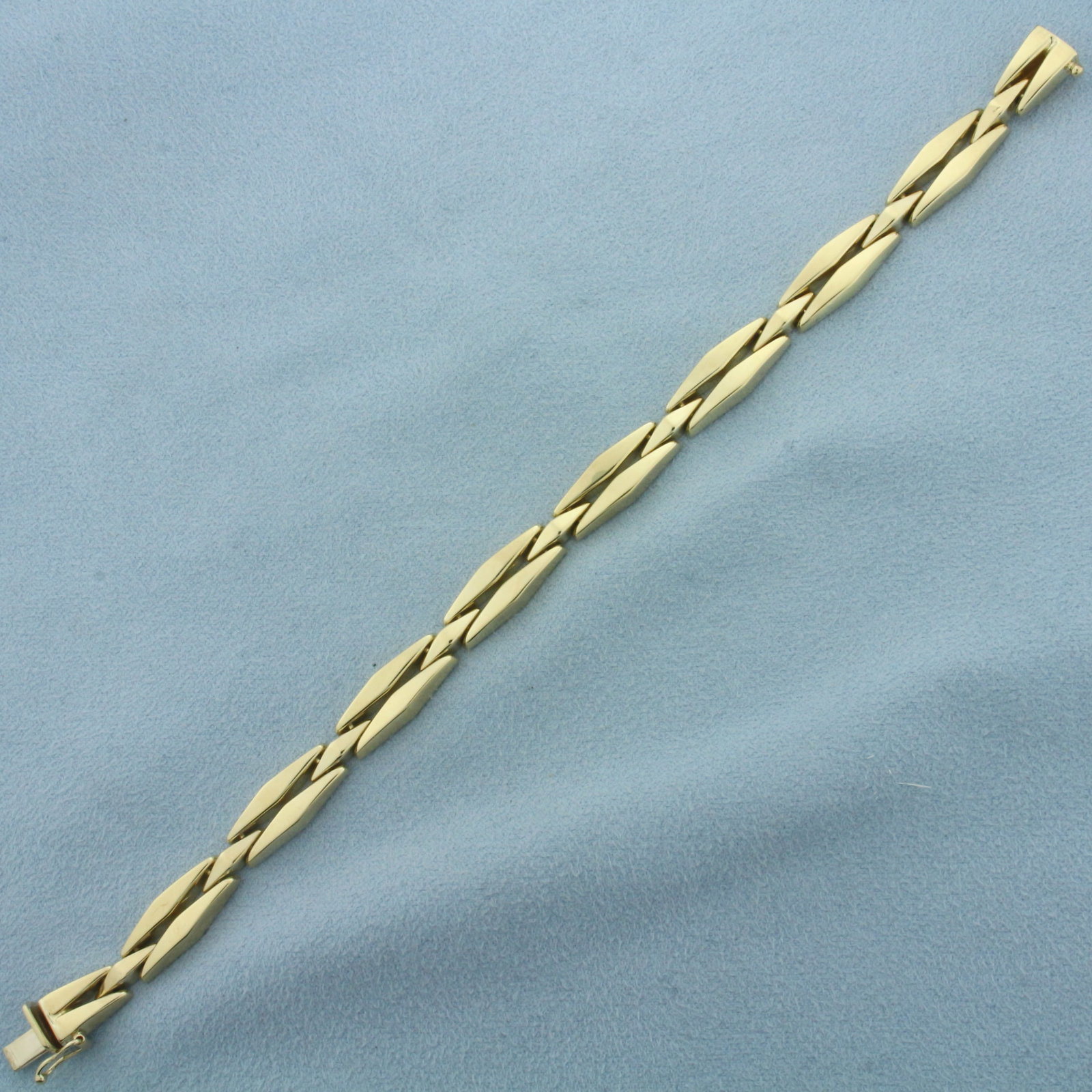 Italian Designer Elongated Diamond Link Bracelet in 14k Yellow Gold: In 14k Yellow Gold. 7 1/4 inches long. 7.6mm wide. Italian made. Concealed slide clasp with safety latch. 13.1g.