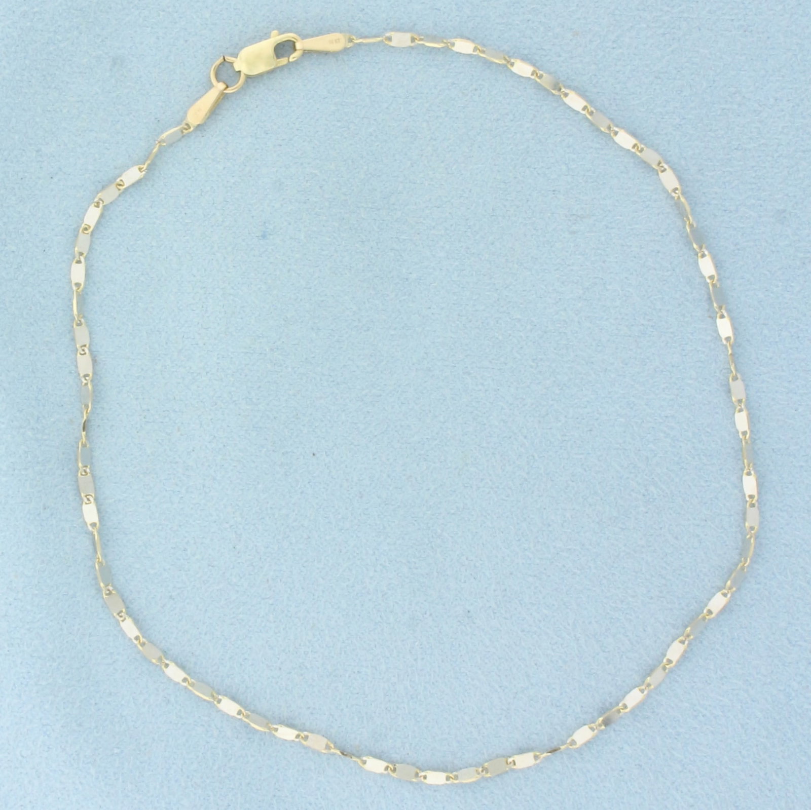 Sparkle Link Anklet in 14k Yellow Gold: In 14k Yellow Gold. 10 1/8 inch long. 1.6mm wide. High polish design for sparkle. Lobster clasp. 2.1g.