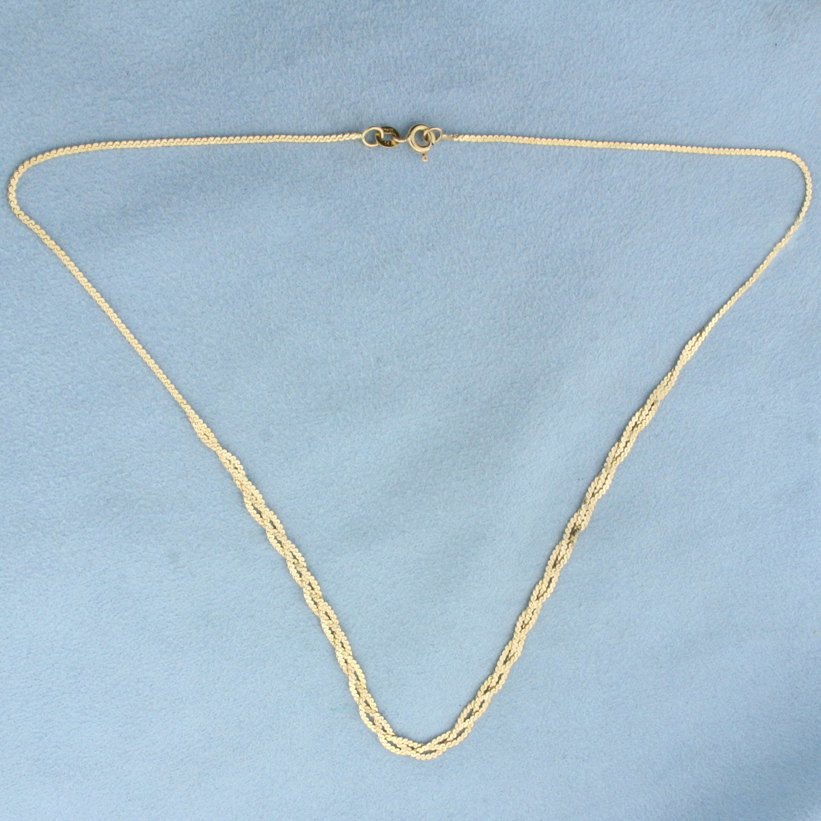 16 Inch Italian Braided S-Link Serpentine Chain Choker Necklace in 14k Yellow Gold: In 14k Yellow Gold. 16 inches long. 1.2mm thick chain. Italian made. Spring clasp. 4.1g.