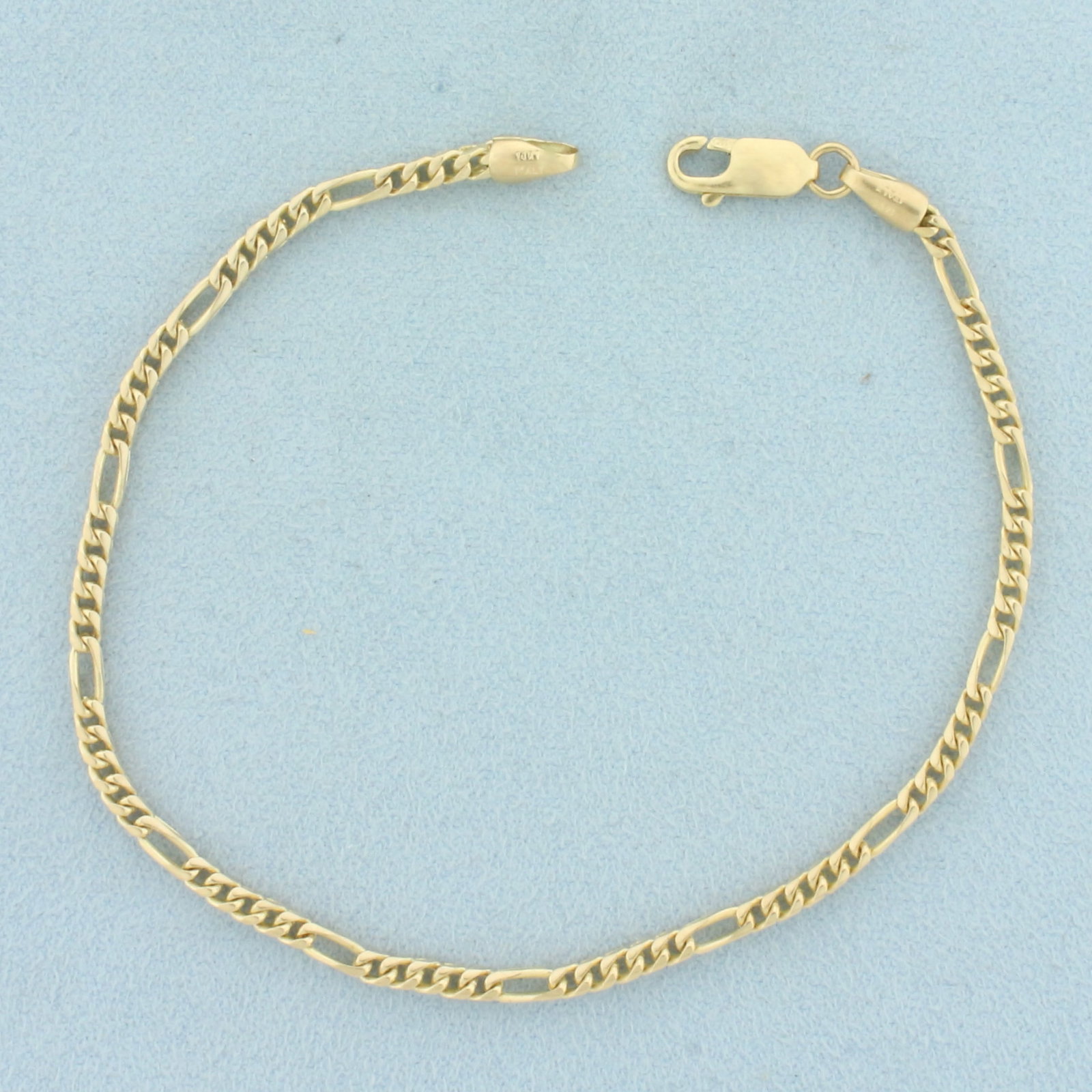 Italian 3D Figaro Link Bracelet in 14k Yellow Gold: In 14k Yellow Gold. 8 1/4 inches long. 2.5mm wide. Italian made. Unique 3D Figaro link. Lobster clasp. 7.6g.