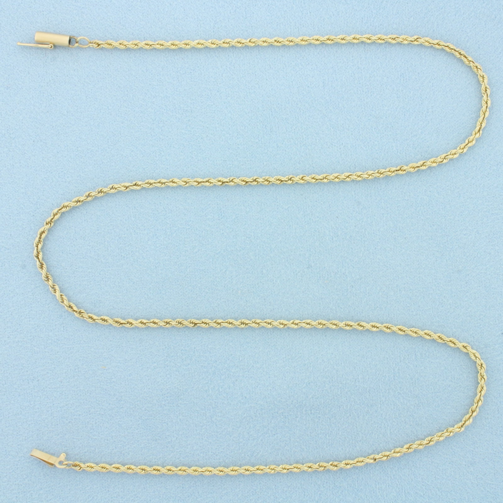 19 Inch Rope Link Chain Necklace in 14k Yellow Gold: In 14k Yellow Gold. 19 inches long. 2mm wide. Barrel clasp with safety latch. 8.2g.