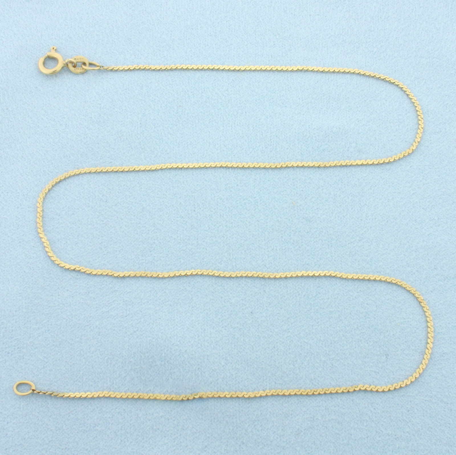 15 Inch Italian S-Link Chain Necklace in 14k Yellow Gold: In 14k Yellow Gold. 15 inches long. 1.2mm wide. Made in Italy. Spring clasp. 2.3g.