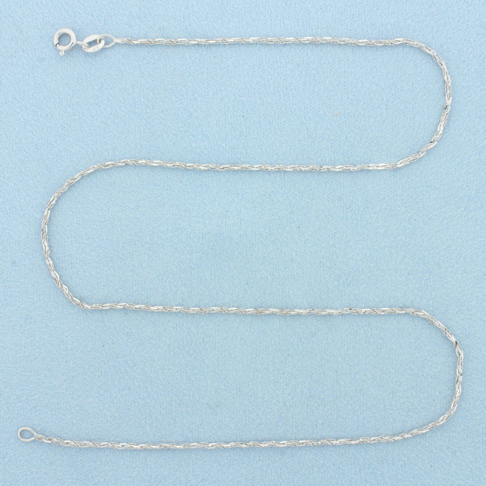 16 Inch Italian Twisting Boston Link Chain Necklace in 14k White Gold: In 14k White Gold. 16 inches long. 1.3mm wide. Made in Italy. Spring clasp. 2.0g.