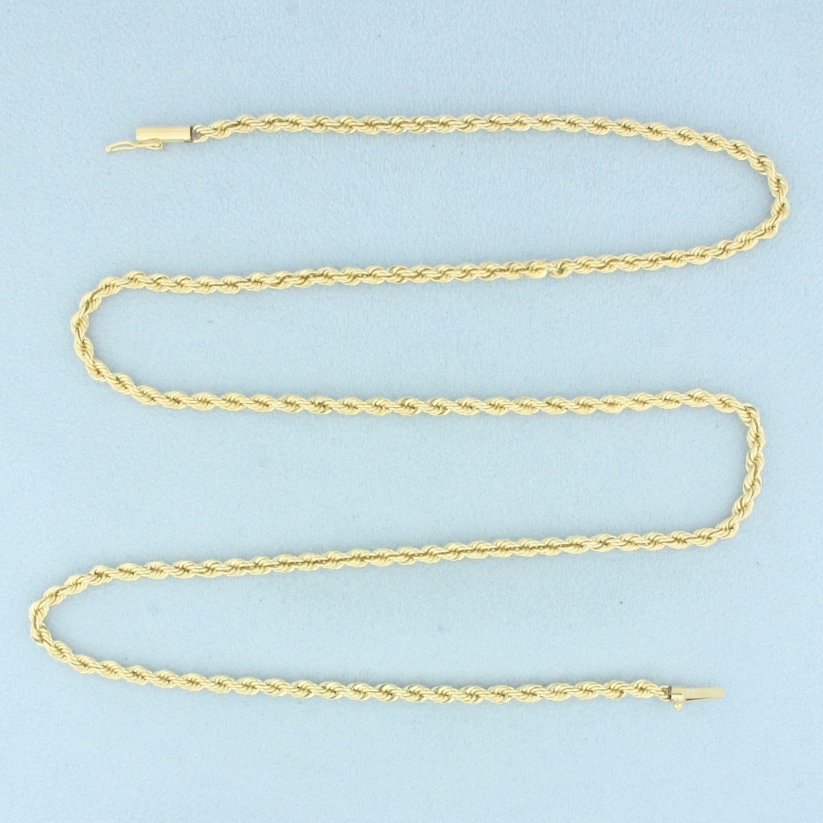 24 Inch Rope Link Chain Necklace in 14k Yellow Gold: In 14k Yellow Gold. 24 inches long. 3mm wide. Barrel clasp with safety latch. 21.1g.