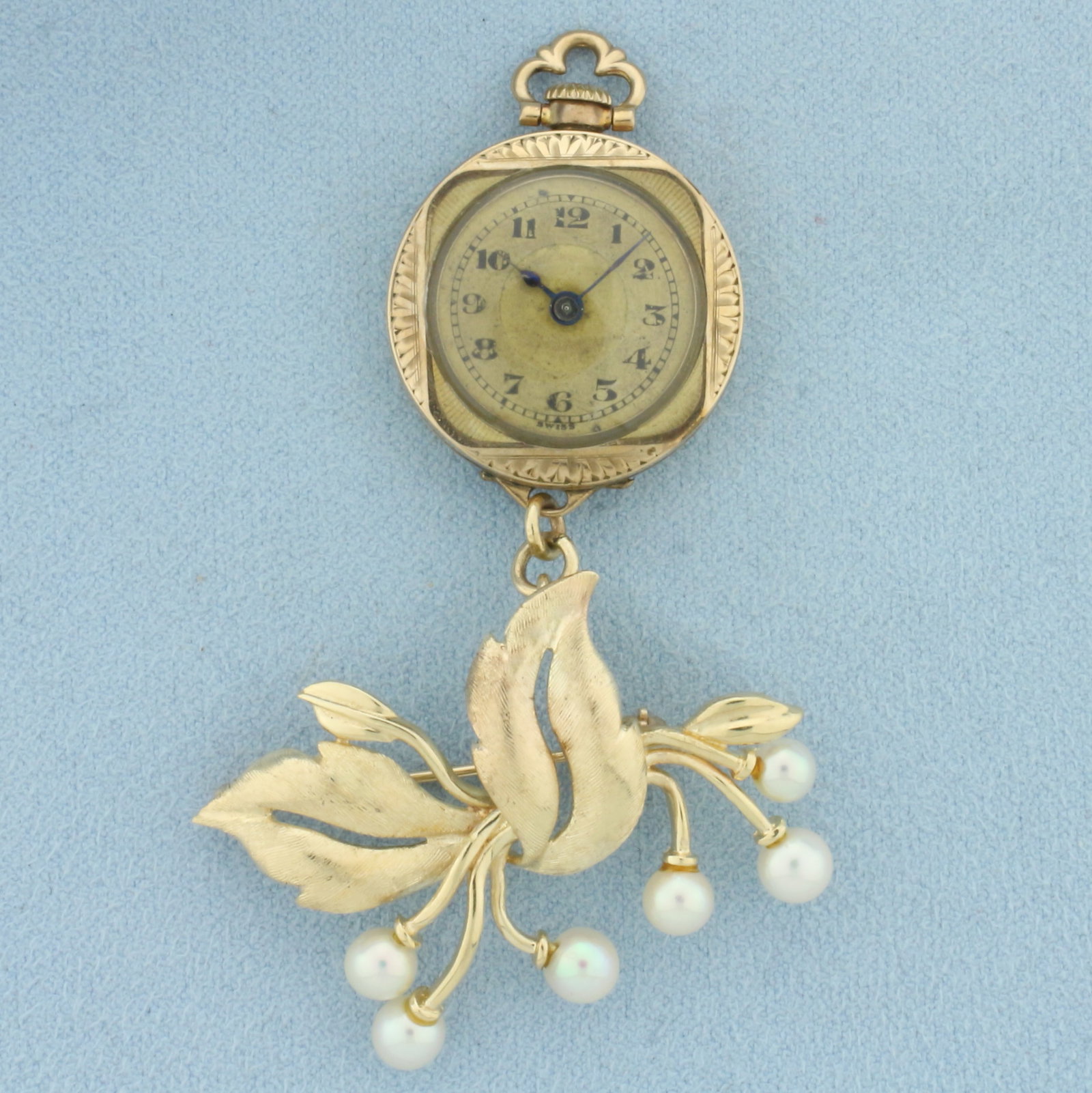 Antique Pearl Wind-Up Watch Brooch in 14k Yellow Gold: In 14k Yellow Gold. Windup movement runs great. Overall great condition. Contains six high quality 5mm cultured akoya pearls with high luster. 2 5/8 inches long. 1 5/8 inch wide. 18.5g.