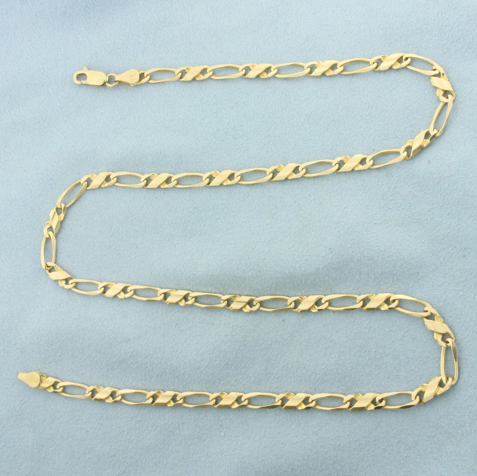 Italian 21 Inch Figaro Link Chain Necklace in 14k Yellow Gold: In 14k Yellow Gold. 21 inches long. 4.3mm wide. Italian made. Lobster clasp. 19.5g.