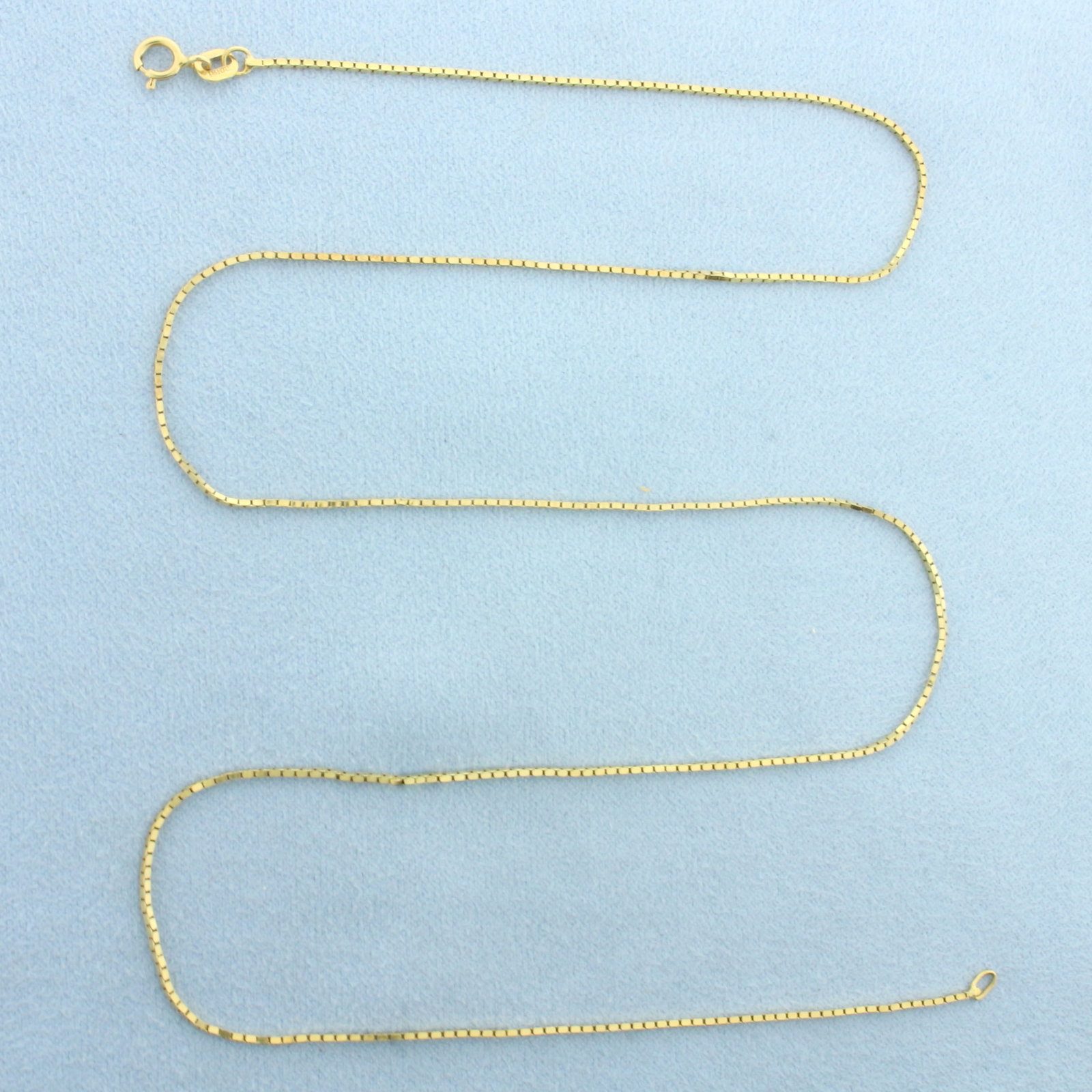 20 Inch Box Link Chain Necklace in 18k Yellow Gold: In 18k Yellow Gold. 20 inches long. 0.8mm wide. Spring clasp. 3.4g.