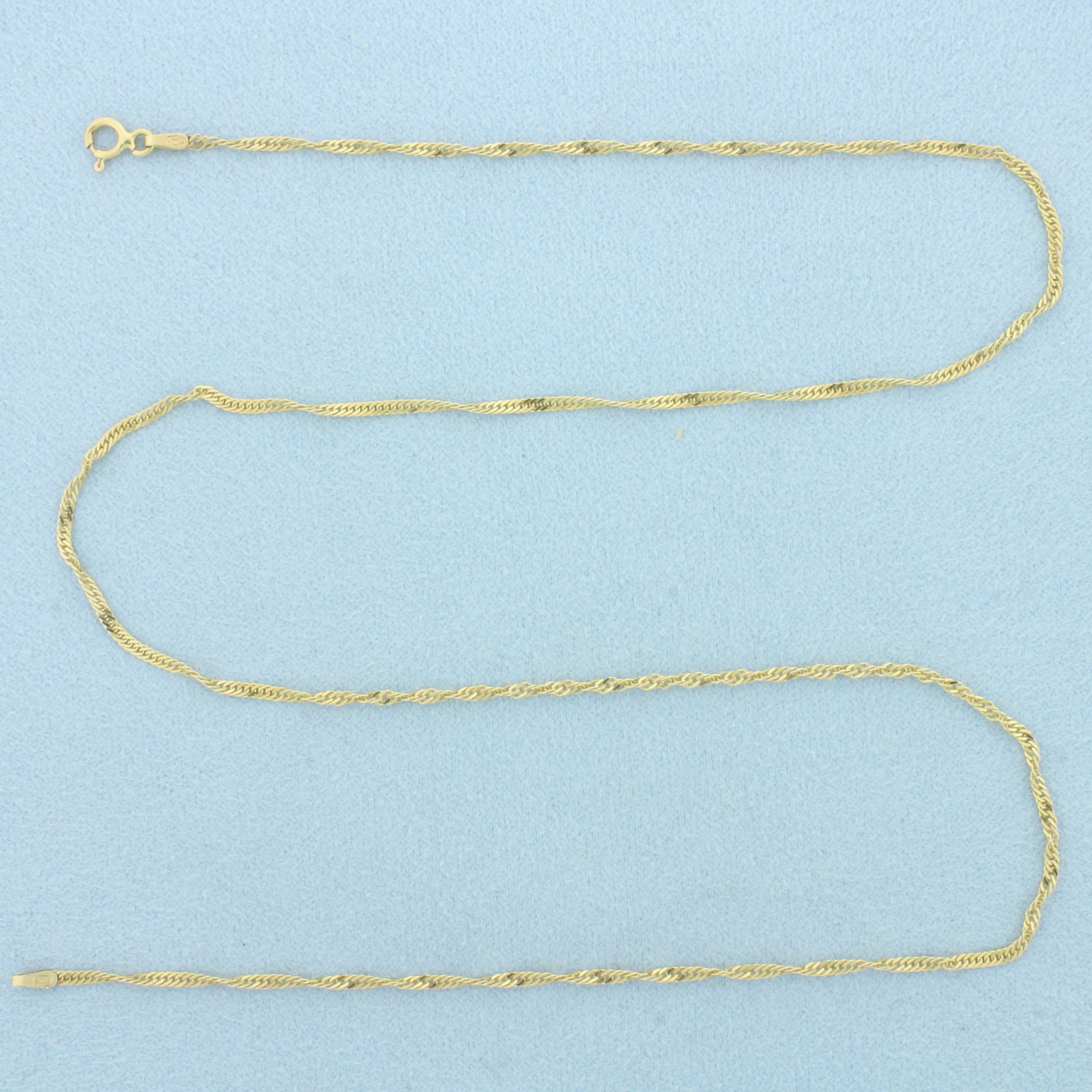 18 Inch Italian Twisting Curb Link Chain Necklace in 14k Yellow Gold: In 14k Yellow Gold. 18 inches long. 1.6mm wide. Made in Italy. Spring clasp. 2.2g.