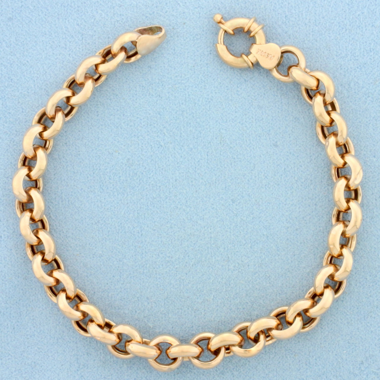 Rose Gold Rolo Cable Link Bracelet in 14k Rose Gold: In 14k Rose Gold. 7 1/8 inches long. 7.2mm wide. Decorative spring clasp. 6.1g.