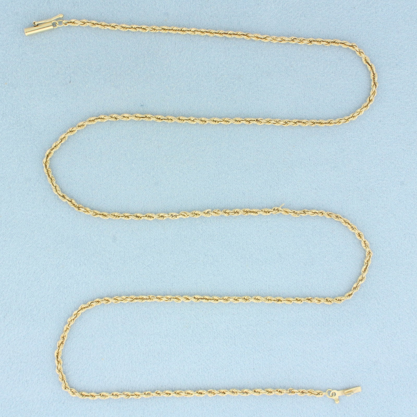 21 Inch Rope Link Chain Necklace in 14k Yellow Gold: In 14k Yellow Gold. 21 inches long. 2.1mm wide. Barrel clasp with safety latch. 6.7g.