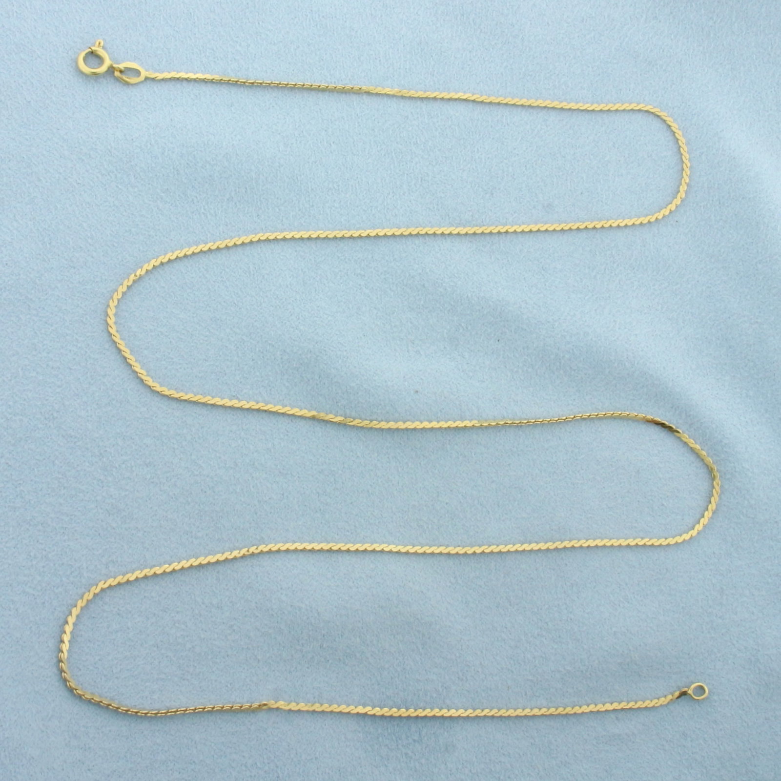 Italian 24 Inch S-Link Chain in 18k Yellow Gold: In 18k Yellow Gold. 24 inch long. 1.3mm wide. Italian. Spring clasp. 5.6g.
