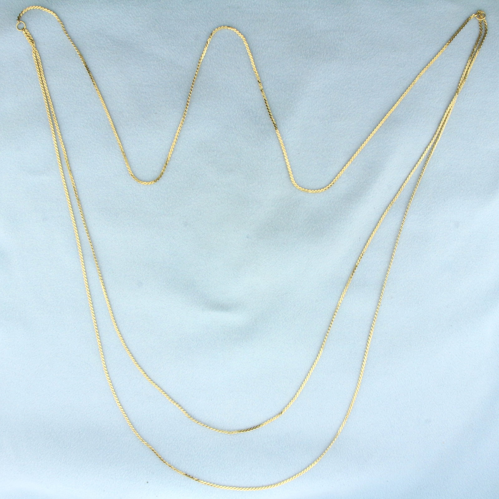 Long Double Strand S-Link Chain Necklace in 14k Yellow Gold: In 14k Yellow Gold. Shorter strand is 32 inches long, longer 33 inches. 1.2mm wide. 6.7g.