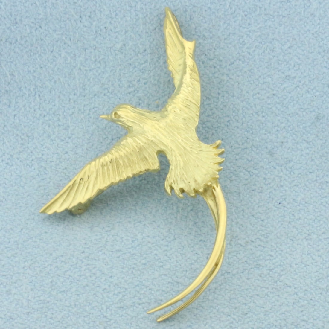 Long Tail Feather Bird Pedant or Pin in 18k Yellow Gold: In 18k Yellow Gold. 1 5/8 inch long. 1 1/4 inch wide at widest. Can be worn as pendant or pin. 3.4g.