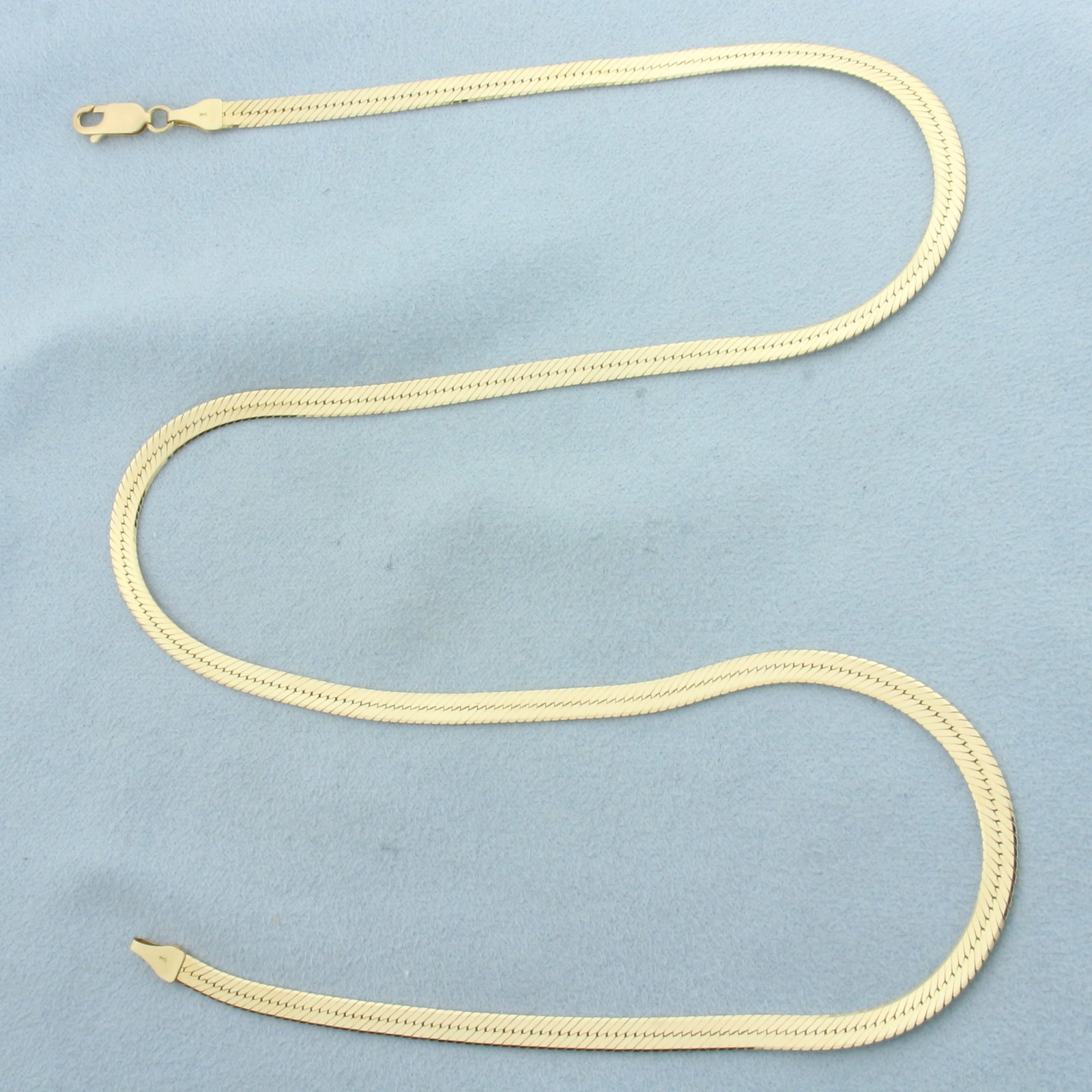 Italian 21 Inch Herringbone Link Chain Necklace in 14k Yellow Gold: In 14k Yellow Gold. 21 inches long. 3.9mm wide. Made in Italy. Lobster clasp. 11.7g.