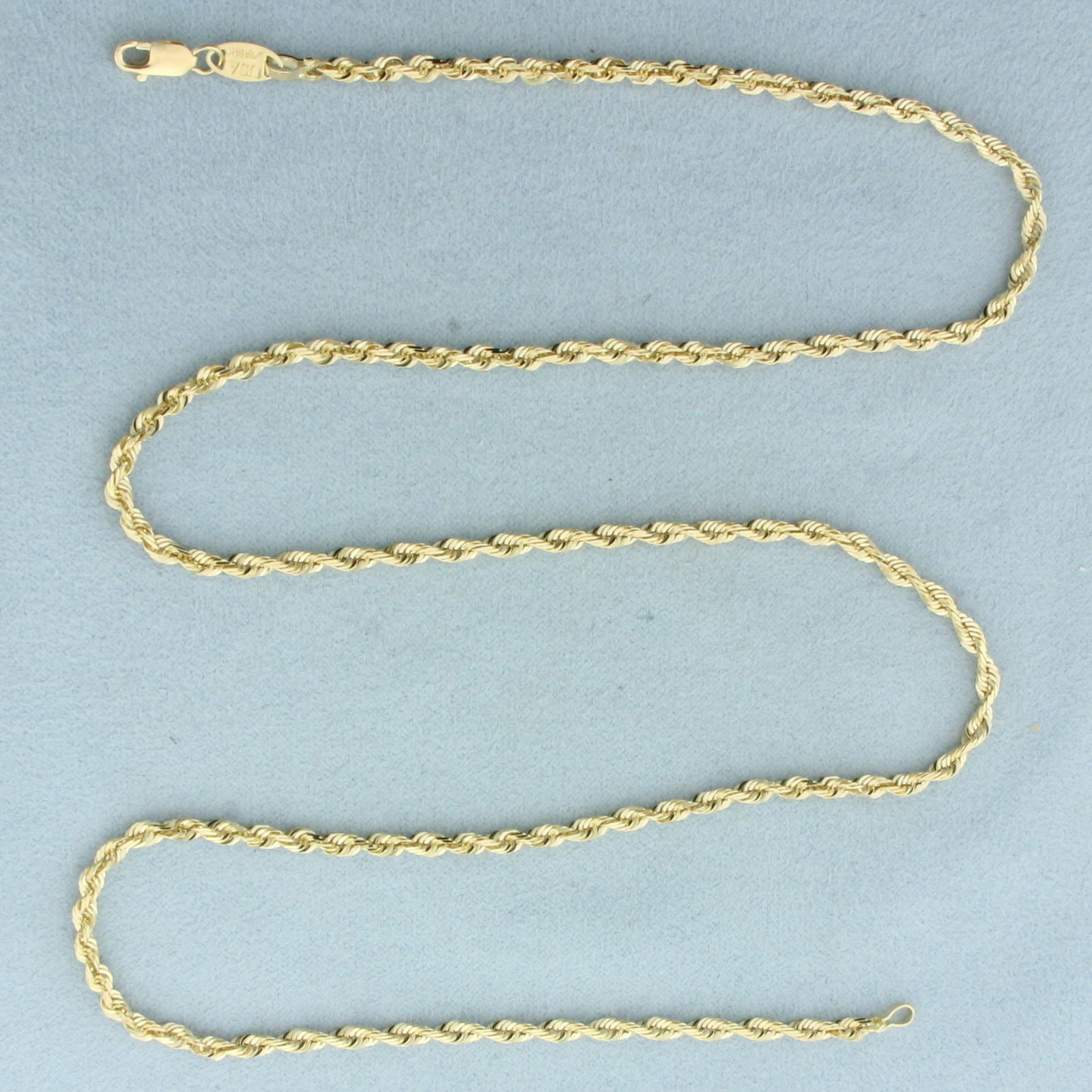 22 Inch Rope Link Chain Necklace in 14k Yellow Gold: In 14k Yellow Gold. 22 inches long. 2.6mm wide. Lobster clasp. 11.2g.