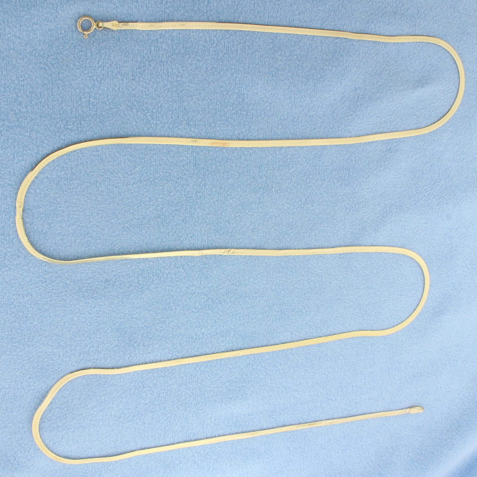 30 Inch Herringbone Link Chain Necklace in 14k Yellow Gold: In 14k Yellow Gold. 30 inches long. 2mm wide. Minor bends in chain, not noticeable. Spring clasp. 4.2g.