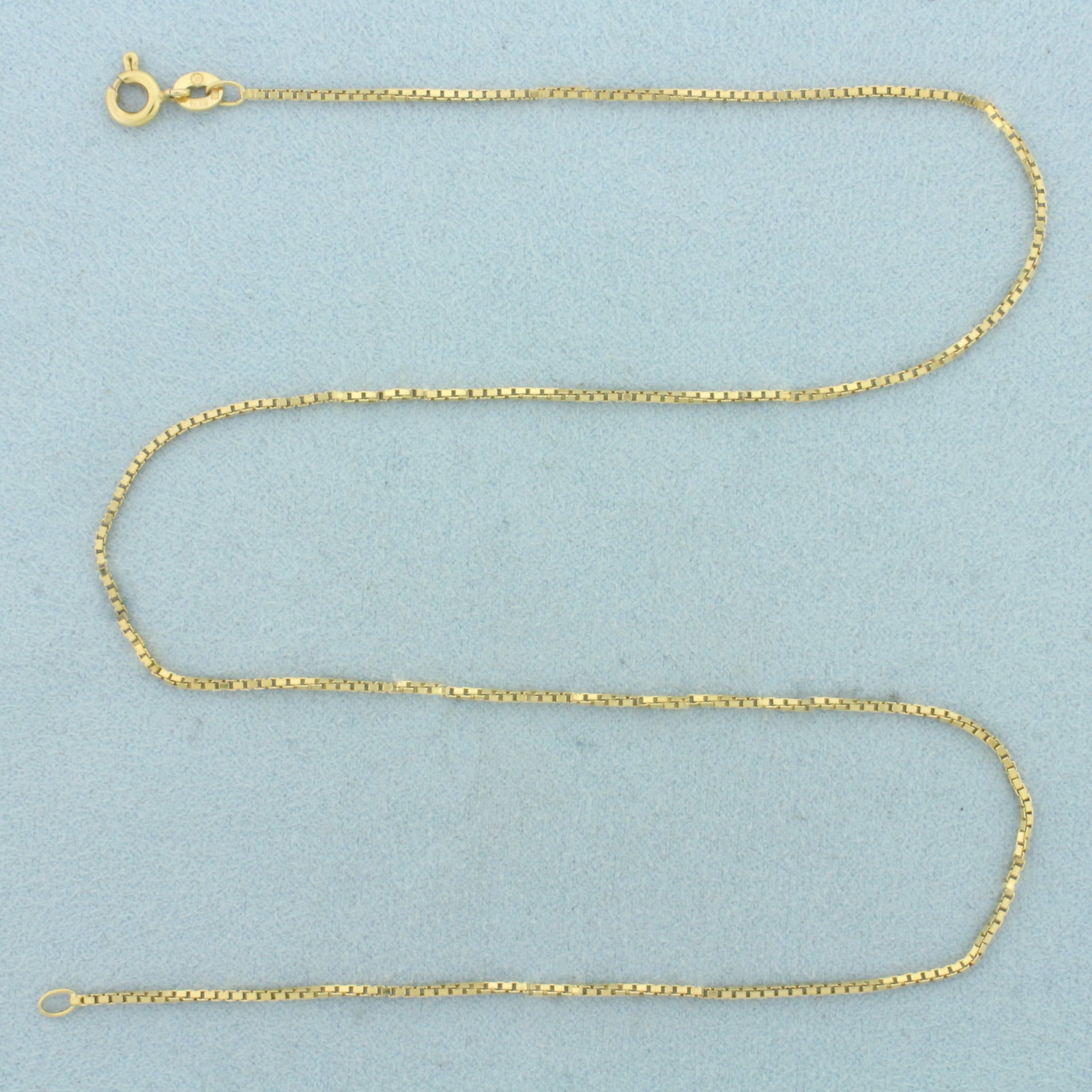 Italian 15 Inch Box Link Chain Necklace in 14k Yellow Gold: In 14k Yellow Gold. 15 inches long. 1mm wide. Made in Italy. Spring clasp. 3.2g.