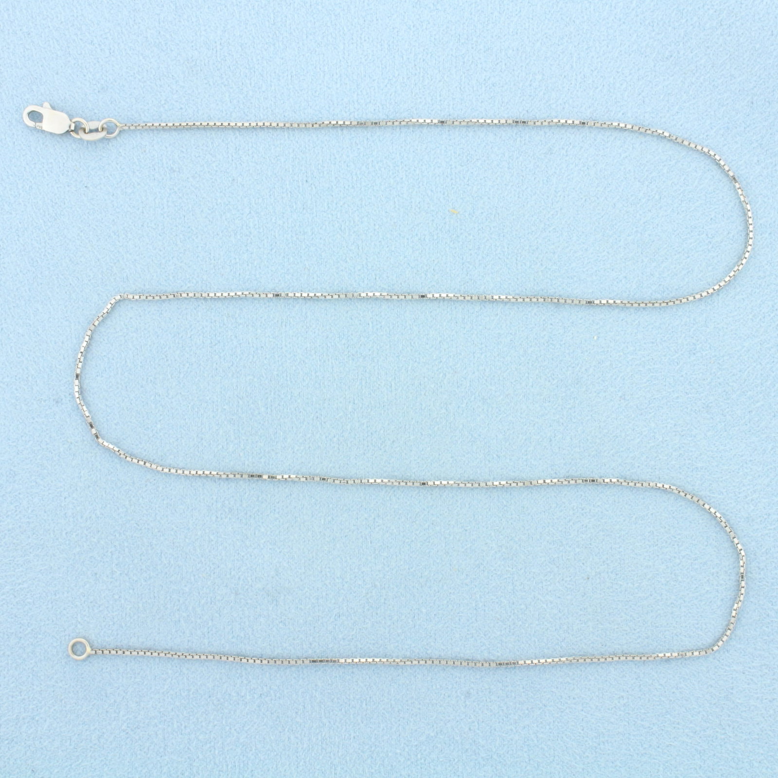 18 Inch Box Link Chain in 14k White Gold: In 14k White Gold. 18 inches long. 0.8mm wide. Lobster clasp. 2.4g.