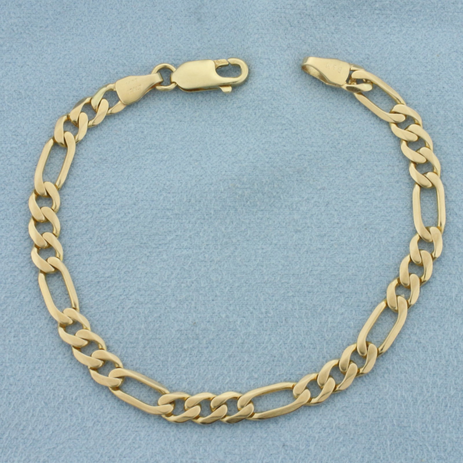 Italian Figaro Link Bracelet in 14k Yellow Gold: In 14k Yellow Gold. 6 1/2 inches long. 4.5mm wide. Italian made. Lobster clasp. 5.2g.